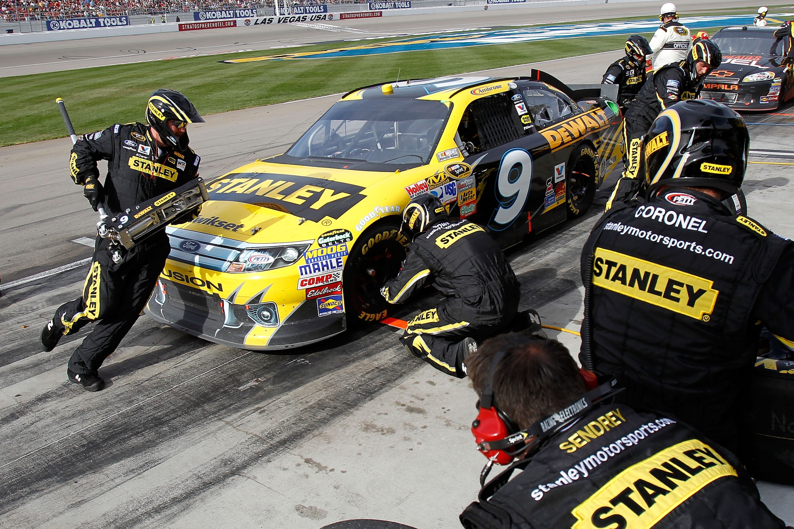 LAS VEGAS, NV - MARCH 06:  Marcos Ambrose, driver of the #9 Stanley Ford, comes in for a pit stop during the NASCAR Sprint Cup Series Kobalt Tools 400 at Las Vegas Motor Speedway on March 6, 2011 in Las Vegas, Nevada.  (Photo by Todd Warshaw/Getty Images