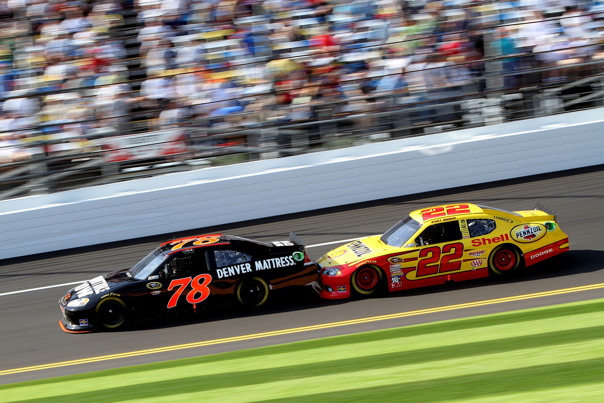 DAYTONA BEACH, FL - FEBRUARY 17:  Kurt Busch, driver of the #22 Shell Pennzoil Dodge, drafts behind Regan Smith, driver of the #78 Furniture Row Racing Chevrolet, during the first race of the NASCAR Sprint Cup Series Gatorade Duel at Daytona International