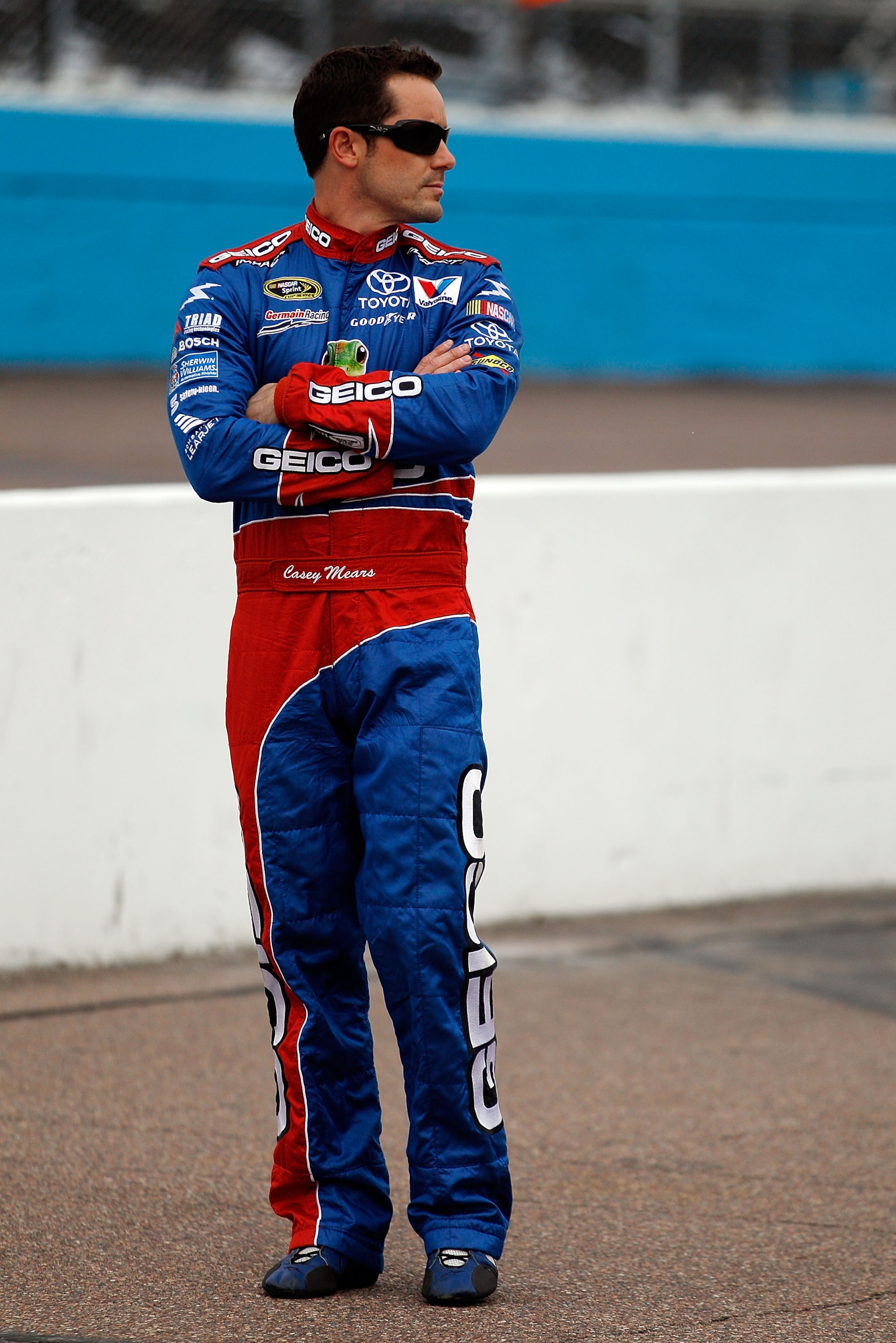 AVONDALE, AZ - FEBRUARY 26:  Casey Mears, driver of the #13 GEICO Toyota, stands on pit road during qualifying for the NASCAR Sprint Cup Series Subway Fresh Fit 500 at Phoenix International Raceway on February 26, 2011 in Avondale, Arizona.  (Photo by Chr
