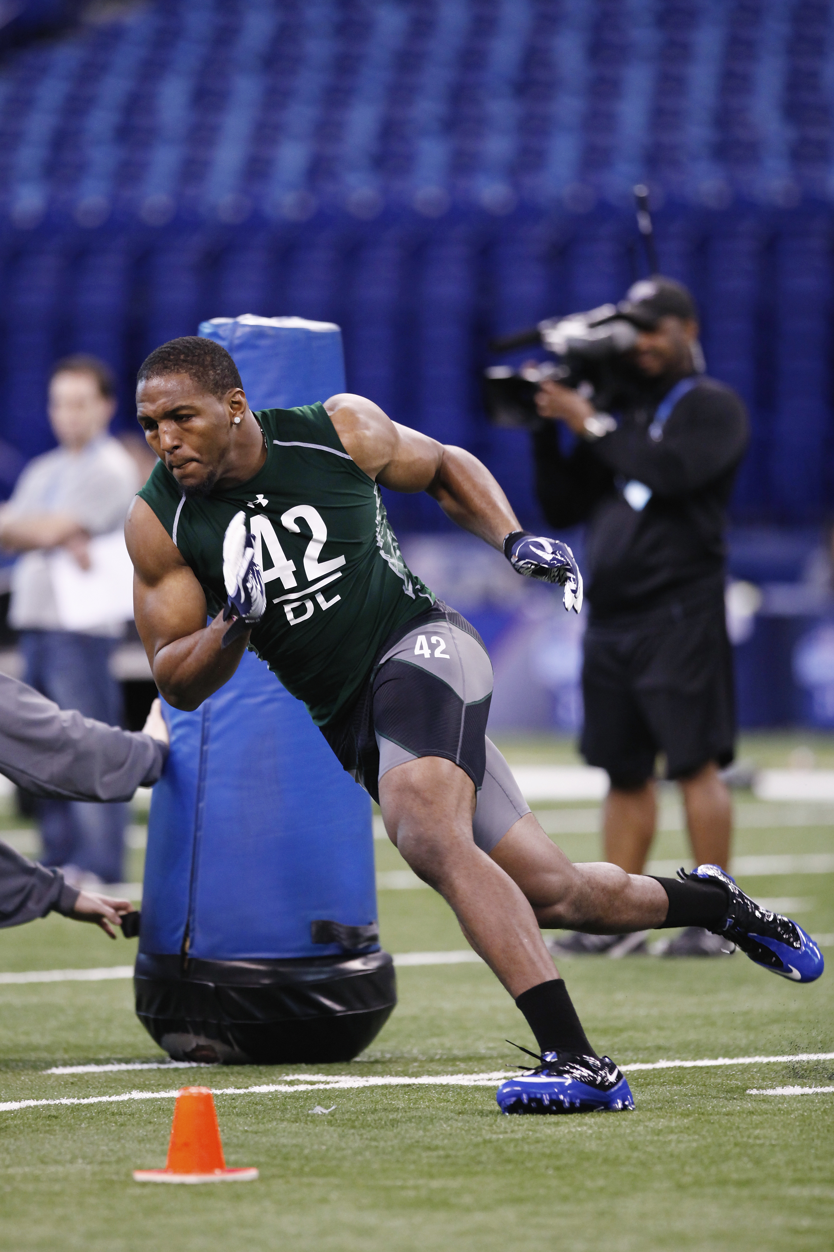 INDIANAPOLIS, IN - FEBRUARY 28:  Defensive lineman Robert Quinn of North Carolina runs through a drill during the 2011 NFL Scouting Combine at Lucas Oil Stadium on February 28, 2011 in Indianapolis, Indiana. (Photo by Joe Robbins/Getty Images)