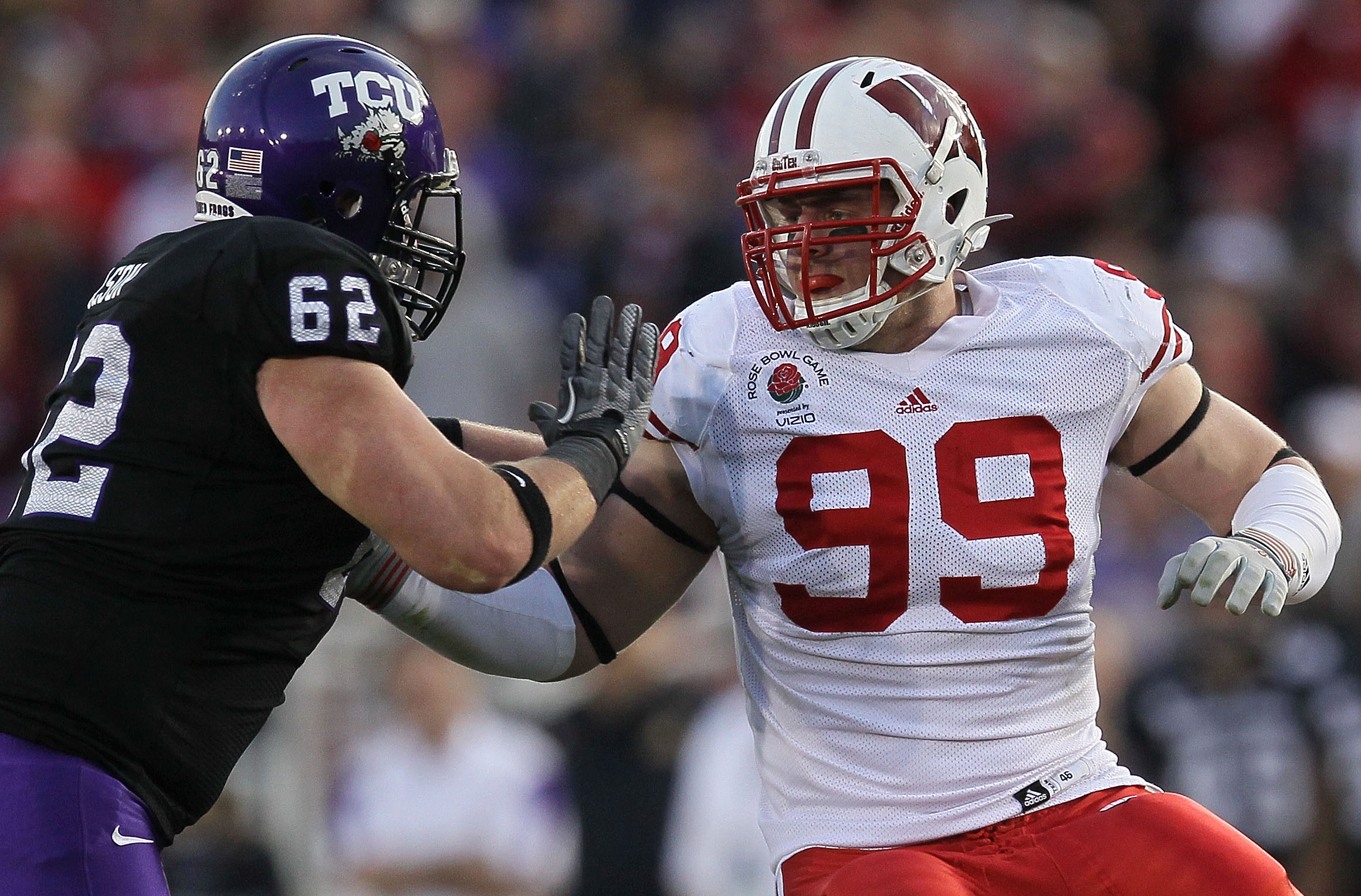 PASADENA, CA - JANUARY 01:  Defensive lineman J.J. Watt #99 of the Wisconsin Badgers rushes the TCU Horned Frogs in the 97th Rose Bowl game on January 1, 2011 in Pasadena, California.  (Photo by Stephen Dunn/Getty Images)