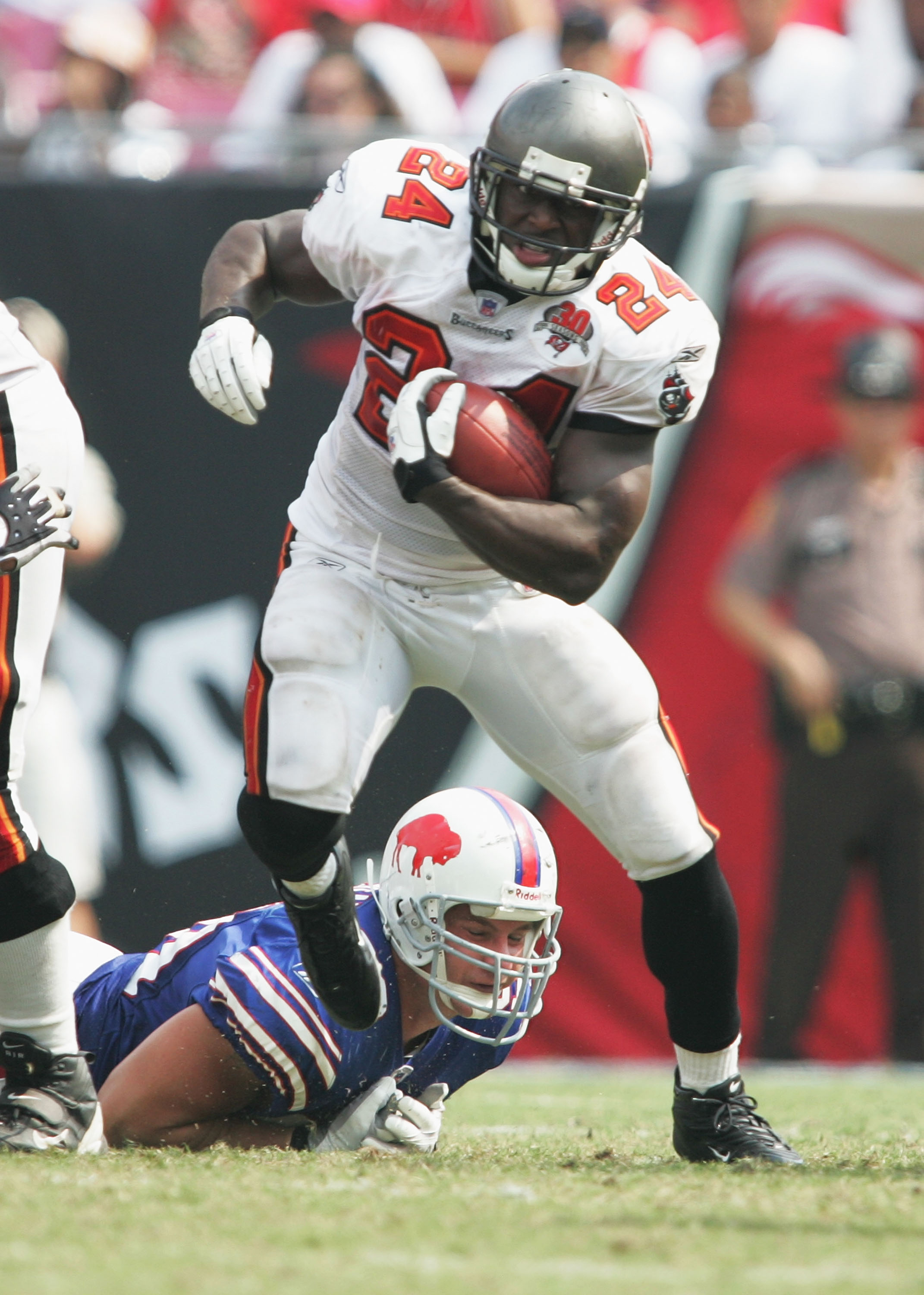 Tampa Bay Buccaneers running back Cadillac Williams (24) finds an opening  in the Detroit Lion defense during an NFL football game between the  Buccaneers and the Lions Sunday in Tampa, Fla, December