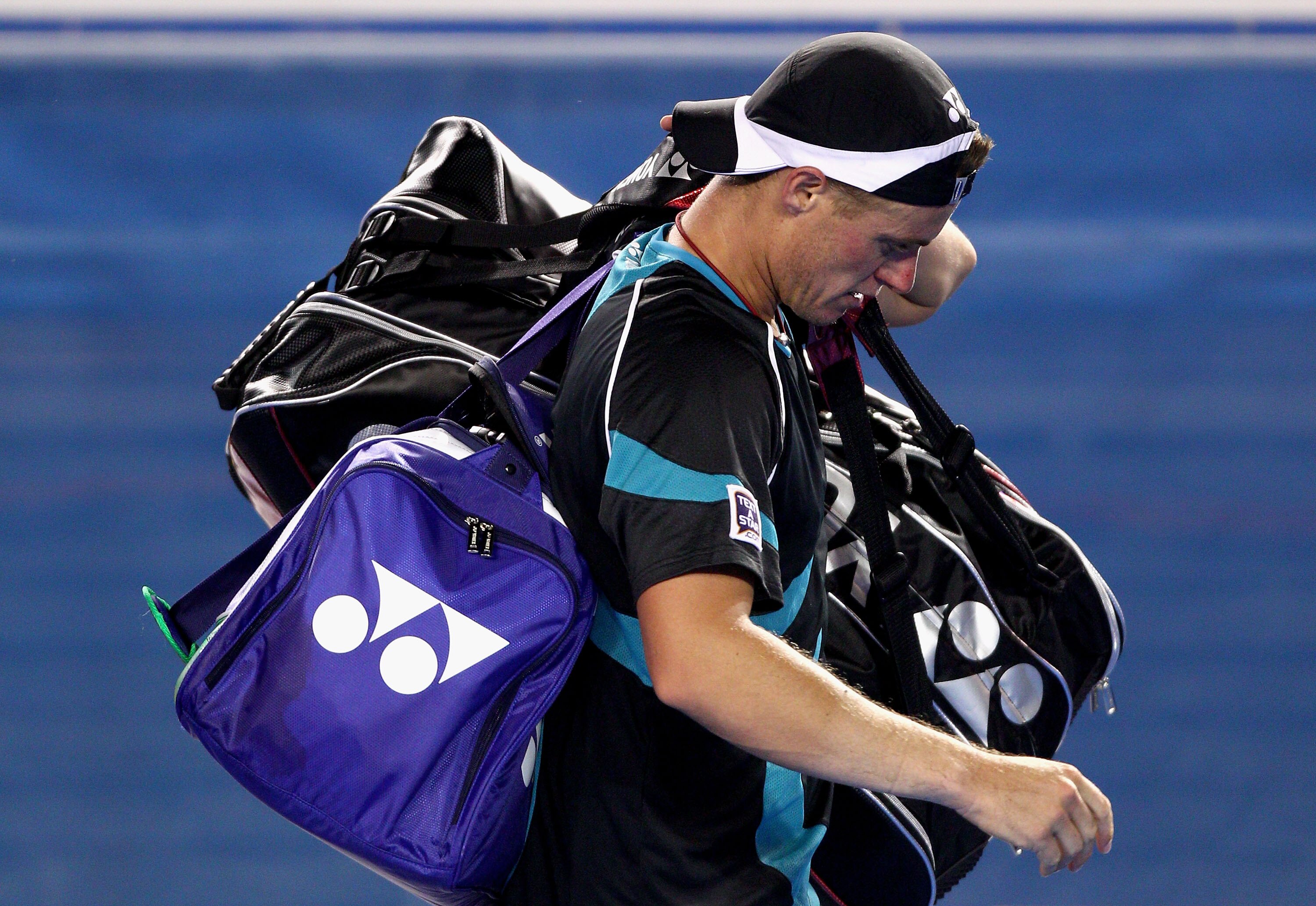 MELBOURNE, AUSTRALIA - JANUARY 18:  Lleyton Hewitt of Australia walks off Rod Laver Arena after losing his first round match against David Nalbandian of Argentina during day two of the 2011 Australian Open at Melbourne Park on January 18, 2011 in Melbourn