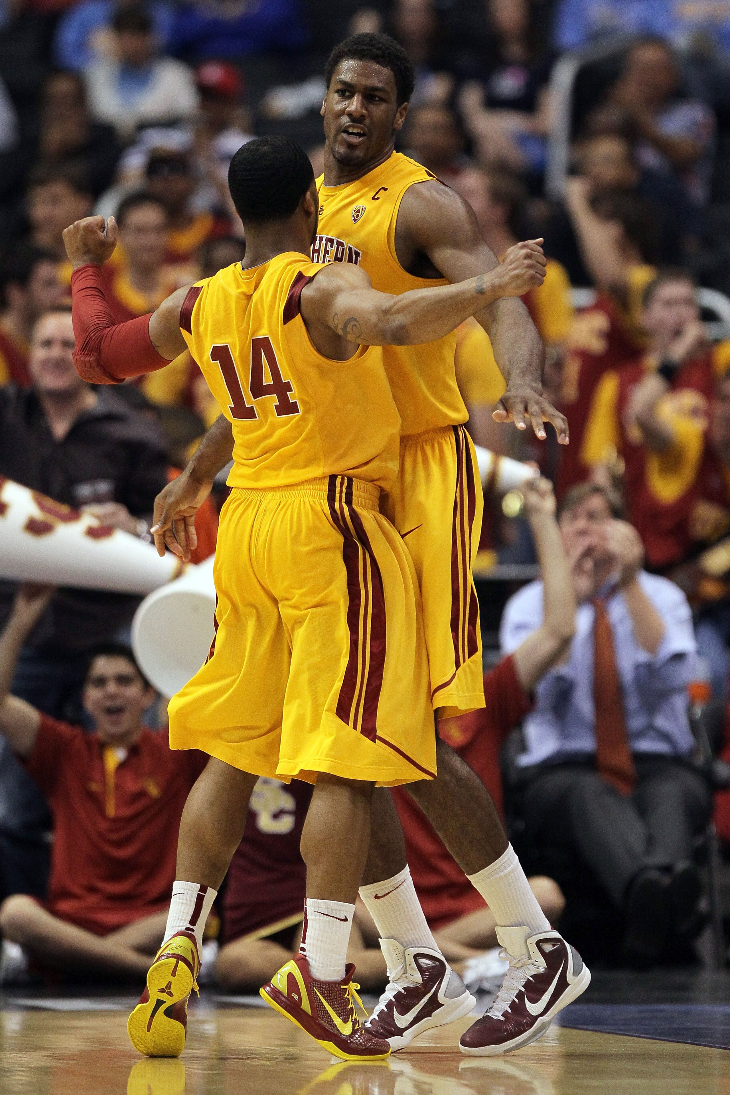 LOS ANGELES, CA - MARCH 10:  Alex Stepheson #1 and Donte Smith #14 of the USC Trojans celebrate on the court in the second half against the California Golden Bears in the quarterfinals of the 2011 Pacific Life Pac-10 Men's Basketball Tournament at Staples
