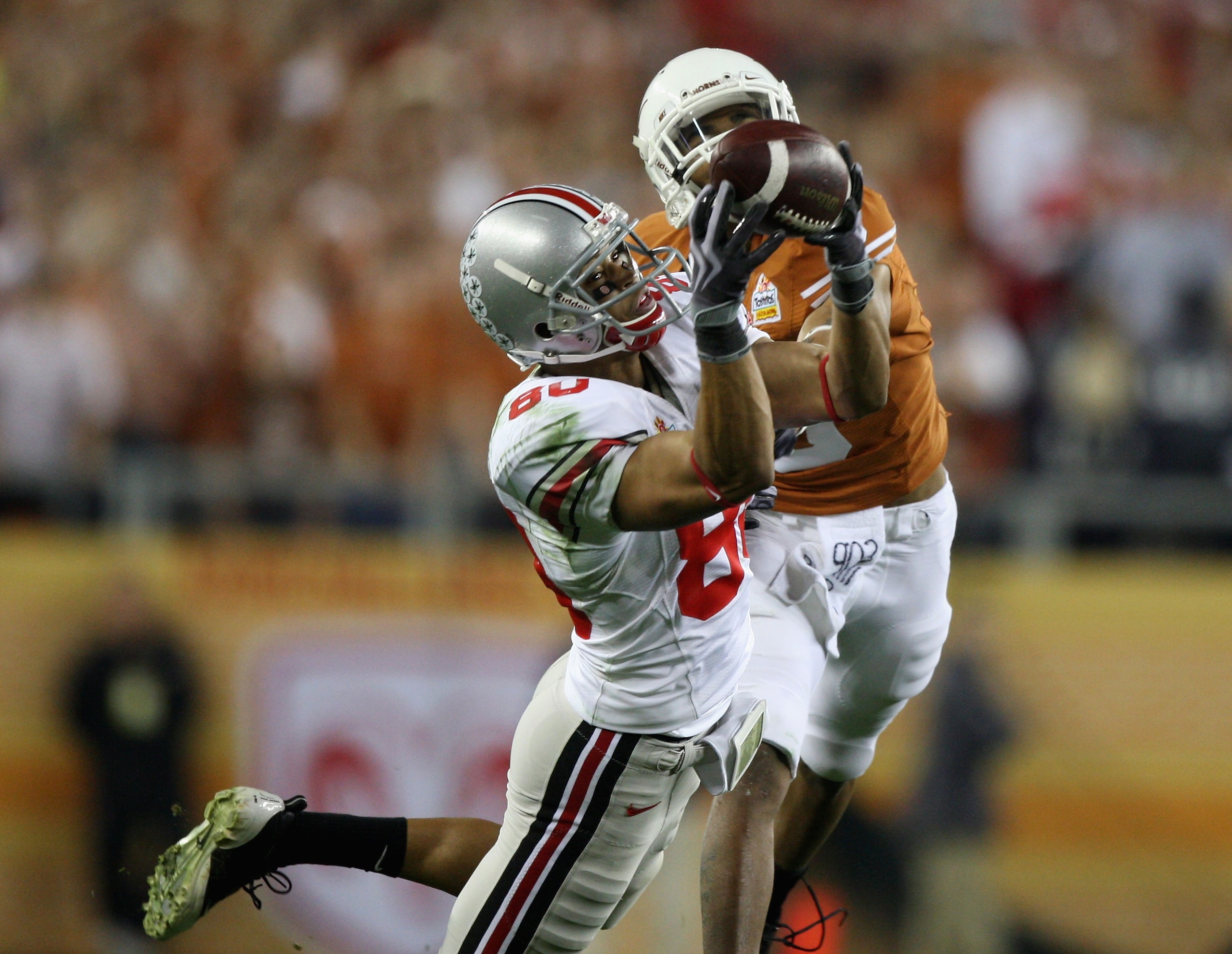 GLENDALE, AZ - JANUARY 05:  Wide receiver Brian Robiskie #80 of the Ohio State Buckeyes makes a diving 48 yard reception past Curtis Brown #3 of the Texas Longhorns during the Tostitos Fiesta Bowl Game on January 5, 2009 at University of Phoenix Stadium i