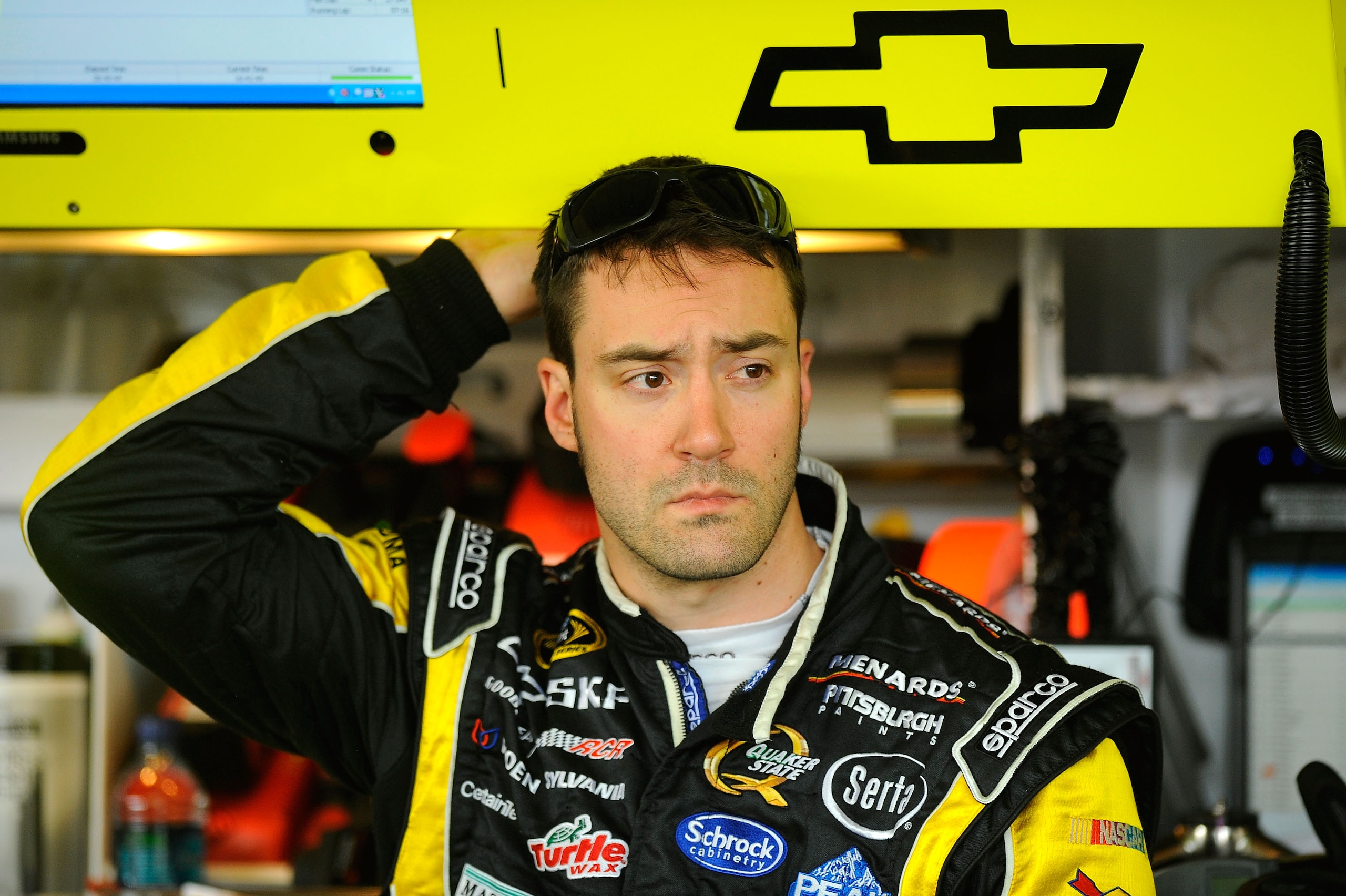 AVONDALE, AZ - FEBRUARY 25:  Paul Menard, driver of the #27 Menards Chevrolet, stands in the garage area during practice for the Subway Fresh Fit 500 at Phoenix International Raceway on February 25, 2011 in Avondale, Arizona.  (Photo by Jared C. Tilton/Ge