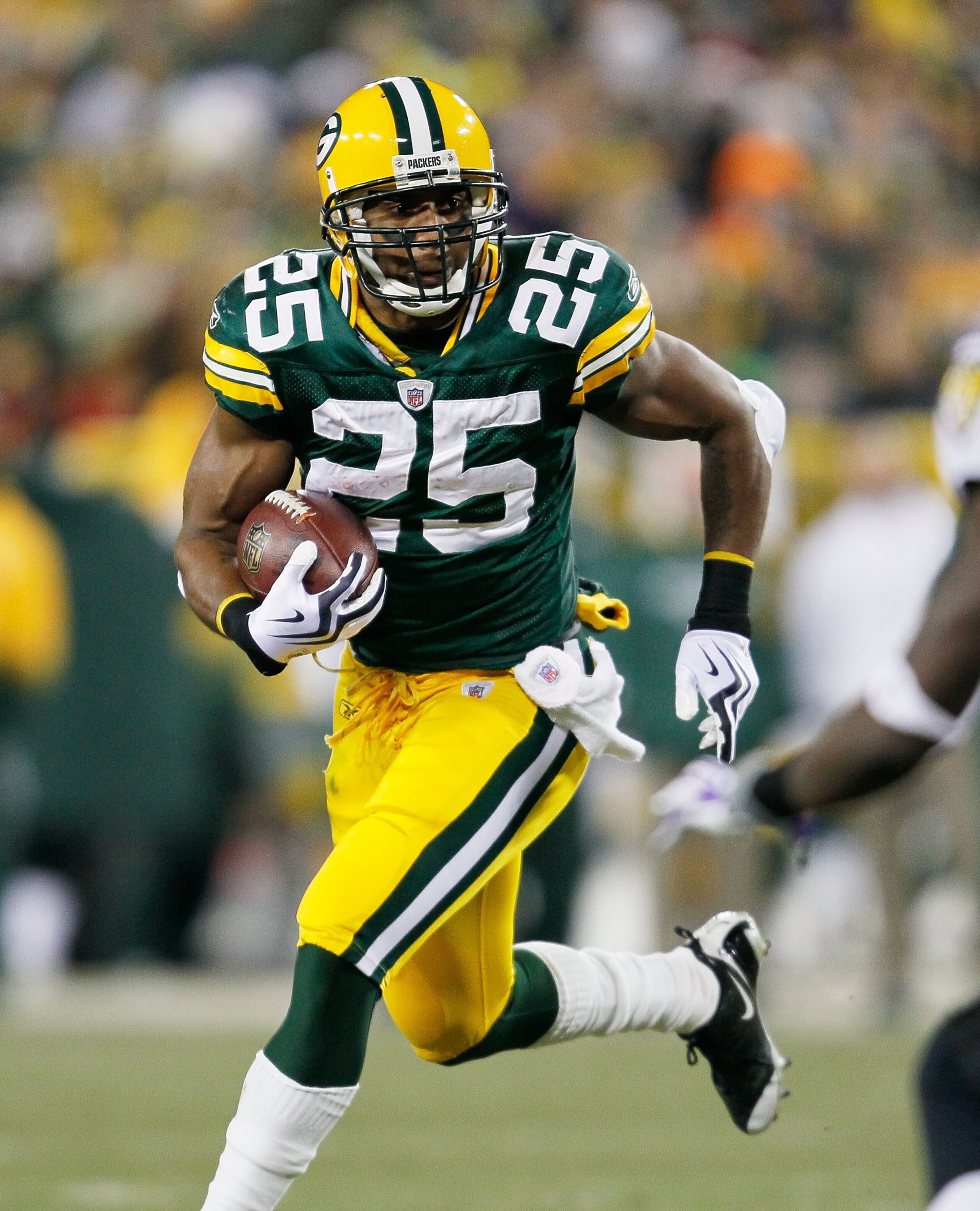 GREEN BAY, WI - DECEMBER 07: Ryan Grant #25 of the Green Bay Packers runs against the Baltimore Ravens at Lambeau Field on December 7, 2009 in Green Bay, Wisconsin. The Packers defeated the Ravens 27-17. (Photo by Jonathan Daniel/Getty Images)