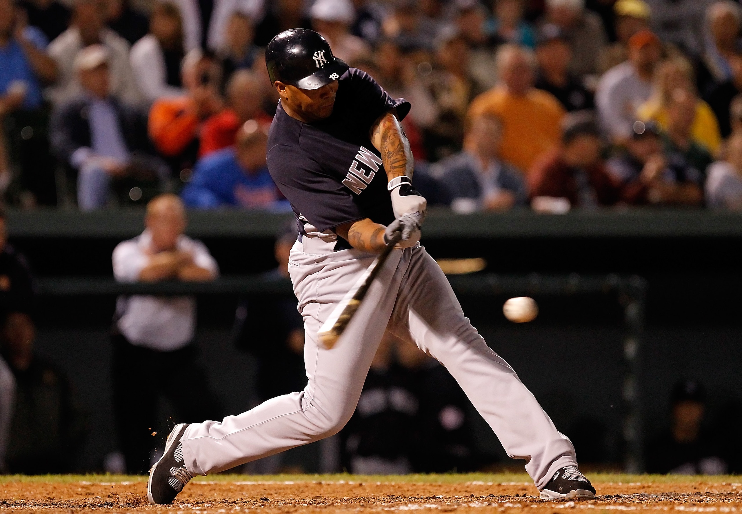 SARASOTA, FL - MARCH 07:  Designated hitter Andruw Jones #18 of the New York Yankees fouls off a pitch against the Baltimore Orioles during a Grapefruit League Spring Training Game at Ed Smith Stadium on March 7, 2011 in Sarasota, Florida.  (Photo by J. M