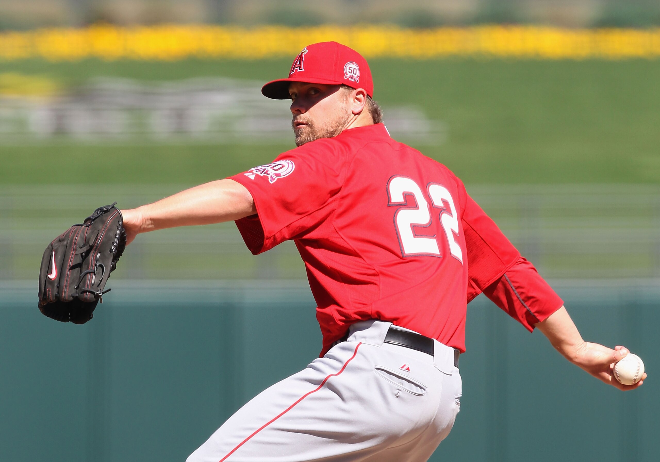 SURPRISE, AZ - MARCH 02:  Relief pitcher Trevor Bell #22 of the Los Angeles Angels of Anaheim pitches against the Texas Rangers during the spring training game at Surprise Stadium on March 2, 2011 in Surprise, Arizona.  (Photo by Christian Petersen/Getty 