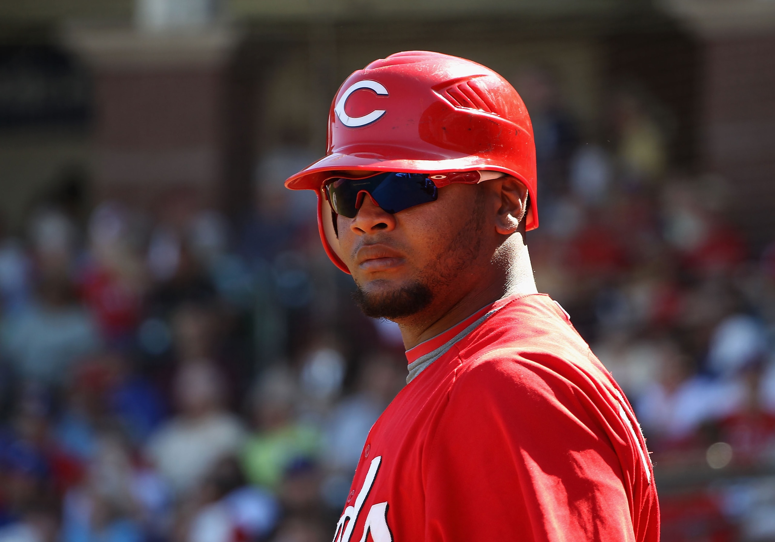 SURPRISE, AZ - MARCH 11:  Juan Francisco #64 of the Cincinnati Reds waits to bat during the third inning of the spring training game against the Texas Rangers at Surprise Stadium on March 11, 2011 in Surprise, Arizona.  (Photo by Christian Petersen/Getty 