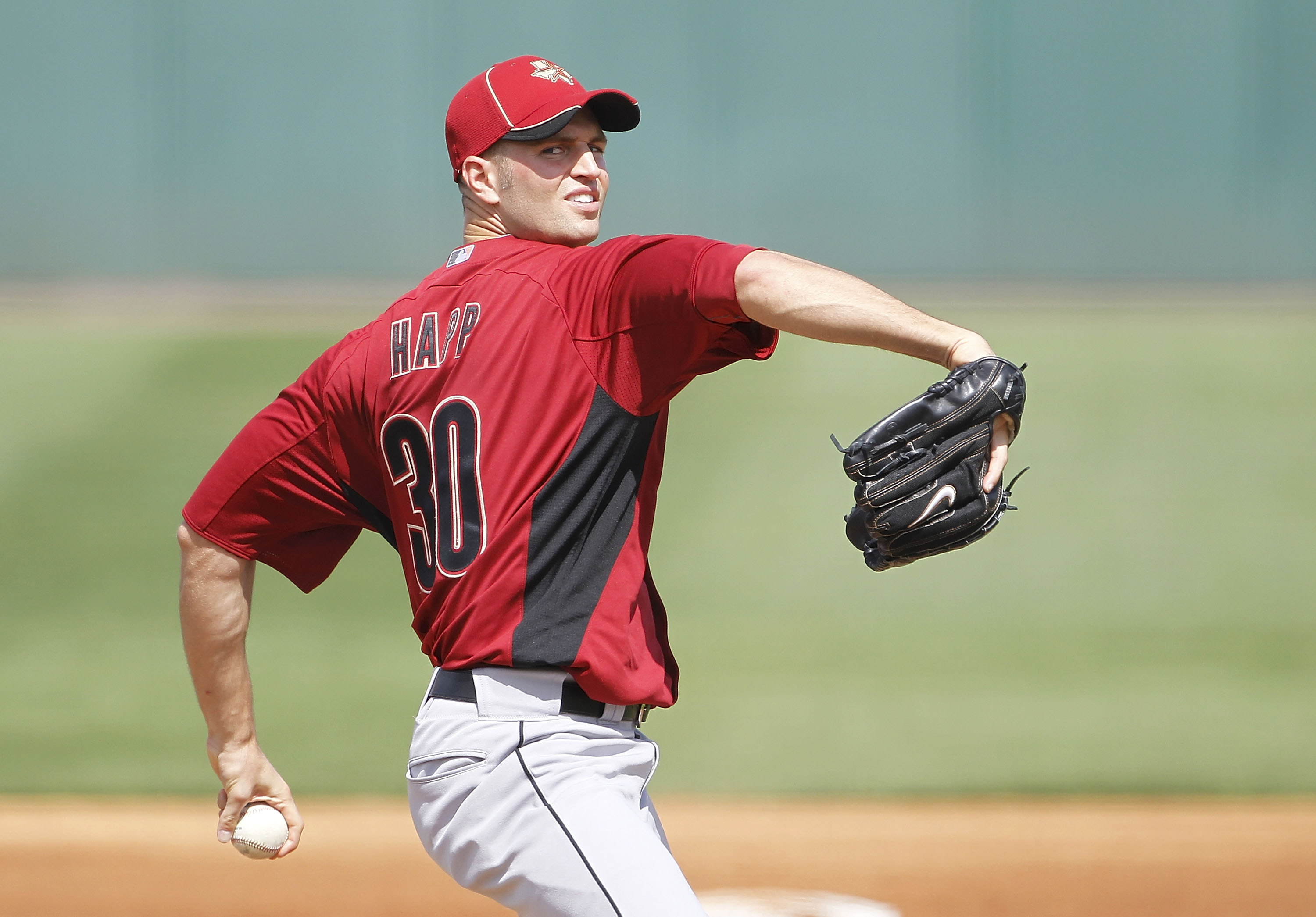 LAKELAND, FL - MARCH 02: J. A. Happ #30 of the Houston Astros pitches during the game against the Detroit Tigers at Joker Marchant Stadium on March 2, 2011 in Lakeland, Florida. The Astros defeated the Tigers 6-3. (Photo by Leon Halip/Getty Images)