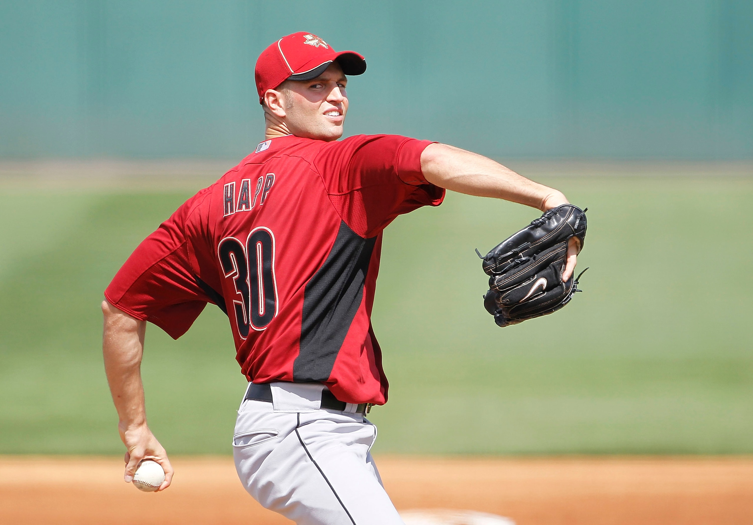 LAKELAND, FL - MARCH 02: J. A. Happ #30 of the Houston Astros pitches during the game against the Detroit Tigers at Joker Marchant Stadium on March 2, 2011 in Lakeland, Florida. The Astros defeated the Tigers 6-3. (Photo by Leon Halip/Getty Images)