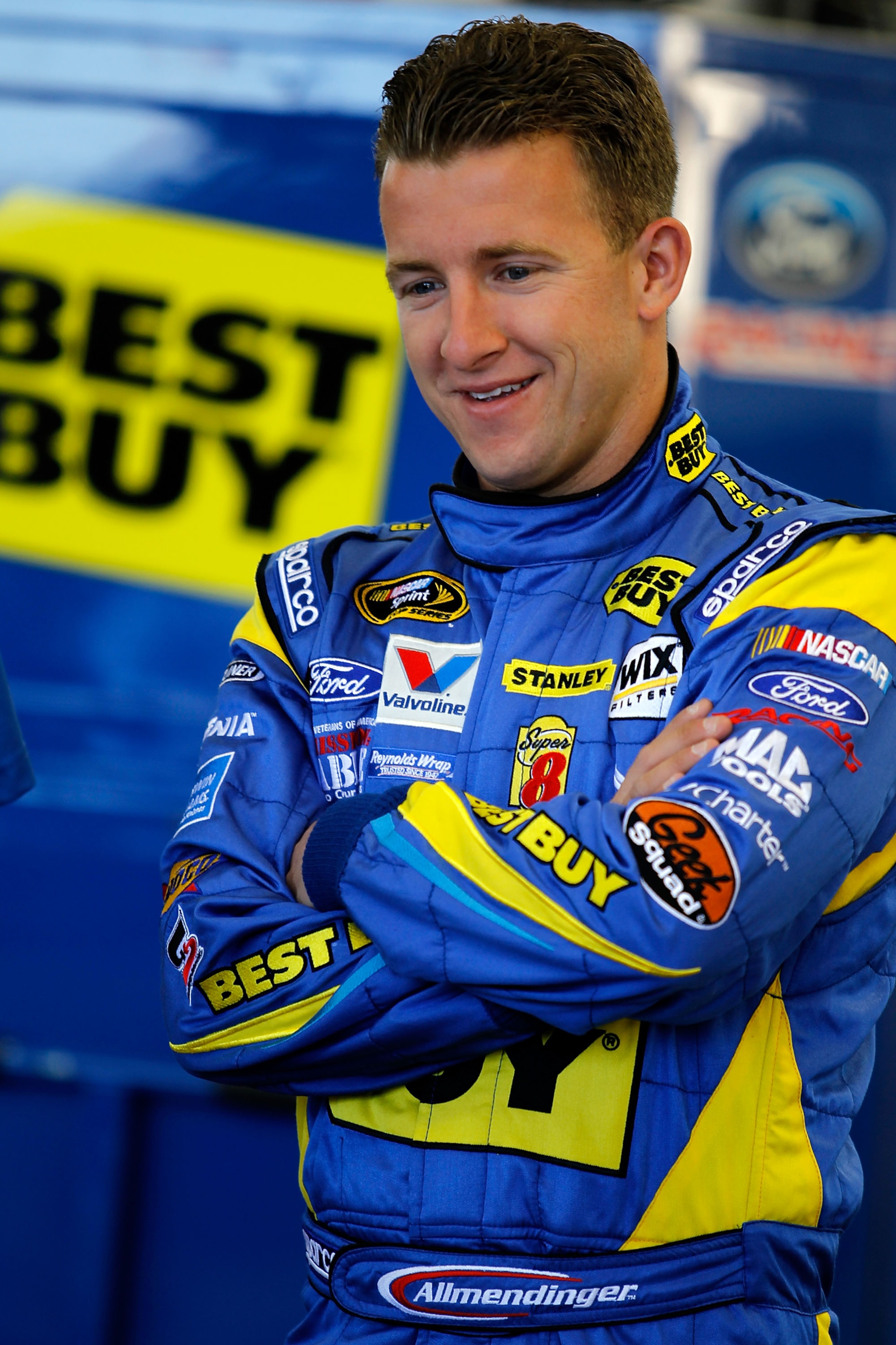 LAS VEGAS, NV - MARCH 04:  A.J. Allmendinger, driver of the #43 Best Buy Ford, stands in the garage during practice for the NASCAR Sprint Cup Series Kobalt Tools 400 at Las Vegas Motor Speedway on March 4, 2011 in Las Vegas, Nevada.  (Photo by Todd Warsha