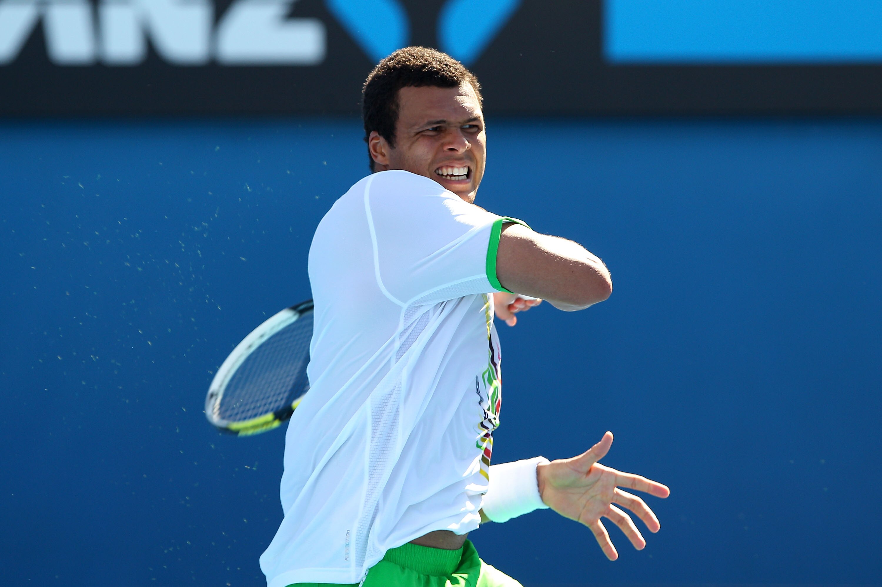 MELBOURNE, AUSTRALIA - JANUARY 20:  Jo-Wilfried Tsonga of France plays a forehand in his second round match against Andreas Seppi of Italy during day four of the 2011 Australian Open at Melbourne Park on January 20, 2011 in Melbourne, Australia.  (Photo b