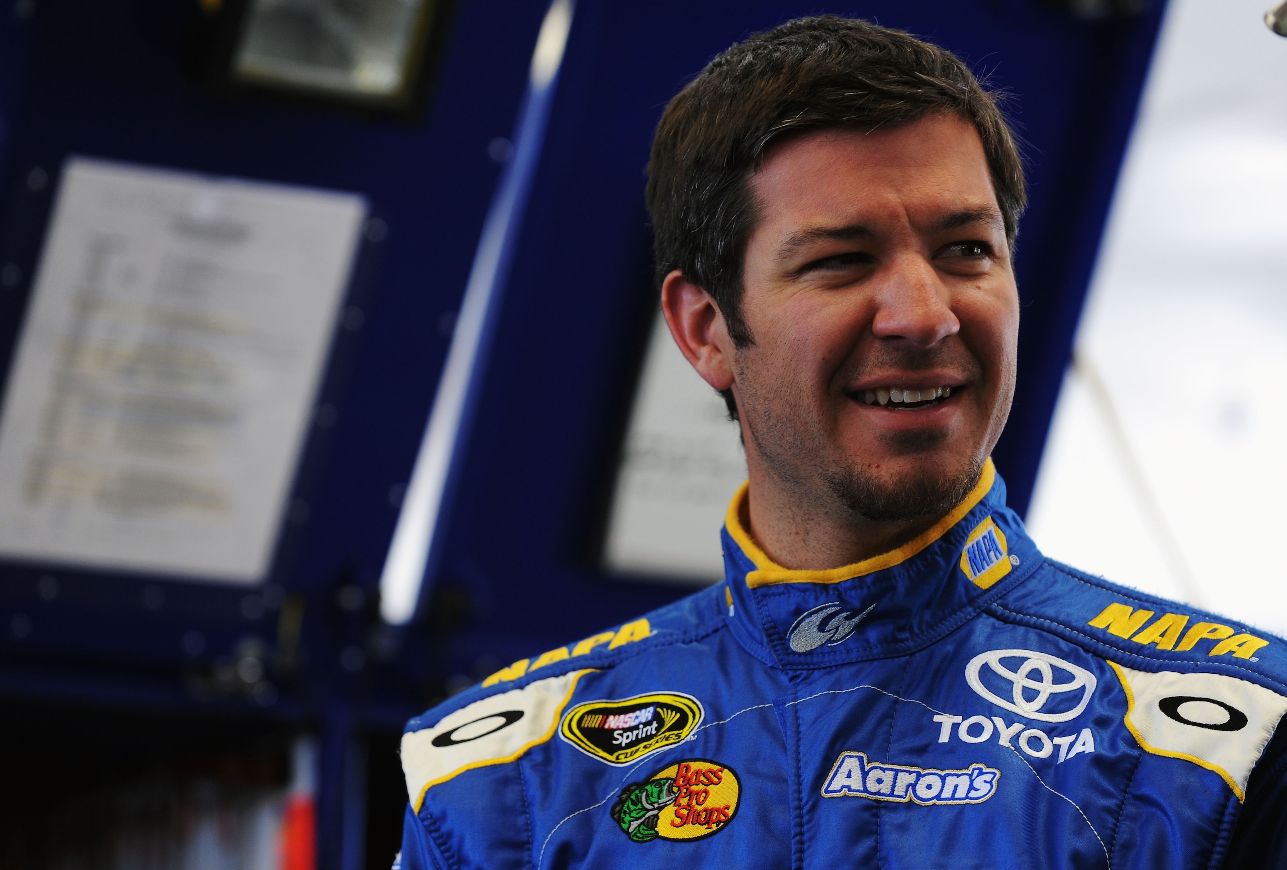 LAS VEGAS, NV - MARCH 04:  Martin Truex Jr., driver of the #56 NAPA Auto Parts Toyota, stands in the garage during practice for the NASCAR Sprint Cup Series Kobalt Tools 400 at Las Vegas Motor Speedway on March 4, 2011 in Las Vegas, Nevada.  (Photo by Jar