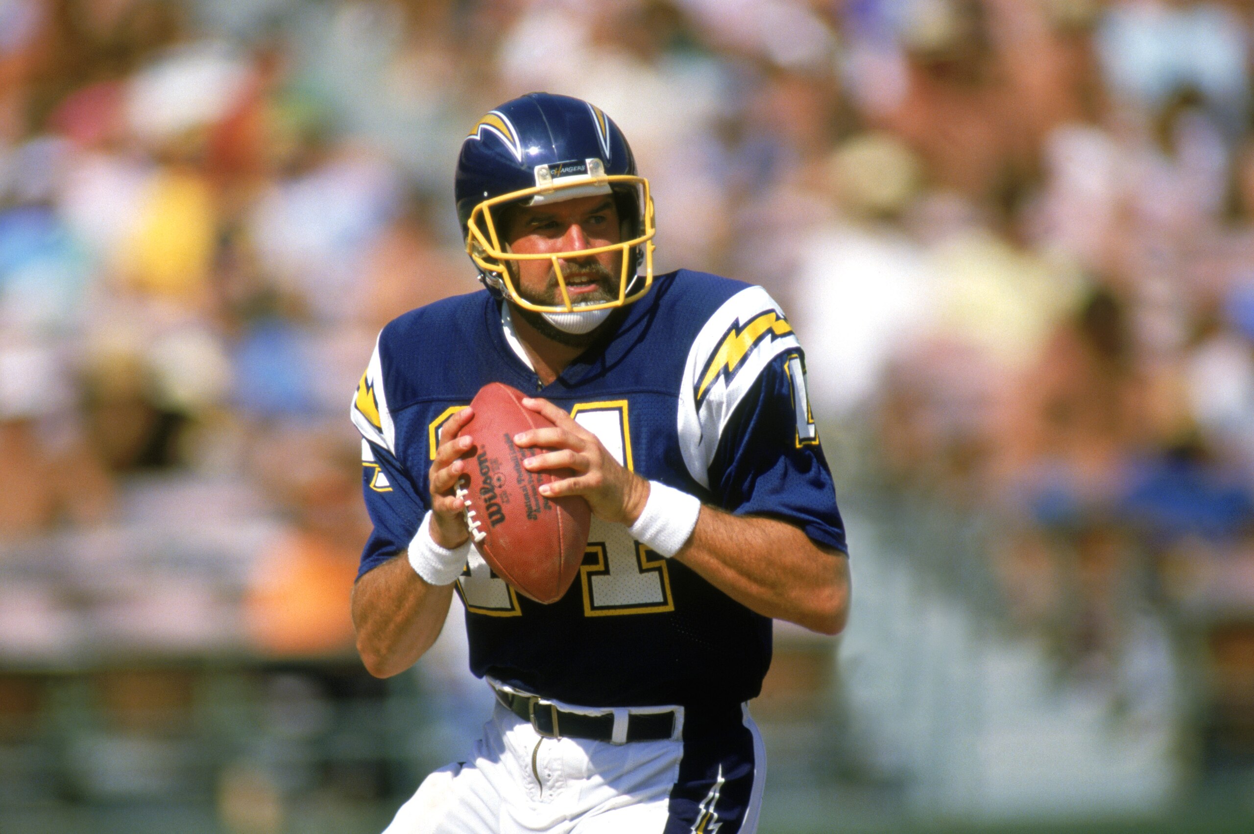 SAN DIEGO -1987: Dan Fouts #14 of the San Diego Chargers looks to pass during a 1987 NFL season game at Jack Murphy Stadium in San Diego, California. ( Photo by: Stephen Dunn/Getty Images) SAN DIEGO -1987: Dan Fouts #14 of the San Diego Chargers looks to pass during a 1987 NFL season game at Jack Murphy Stadium in San Diego, California. ( Photo by: Stephen Dunn/Getty Images)