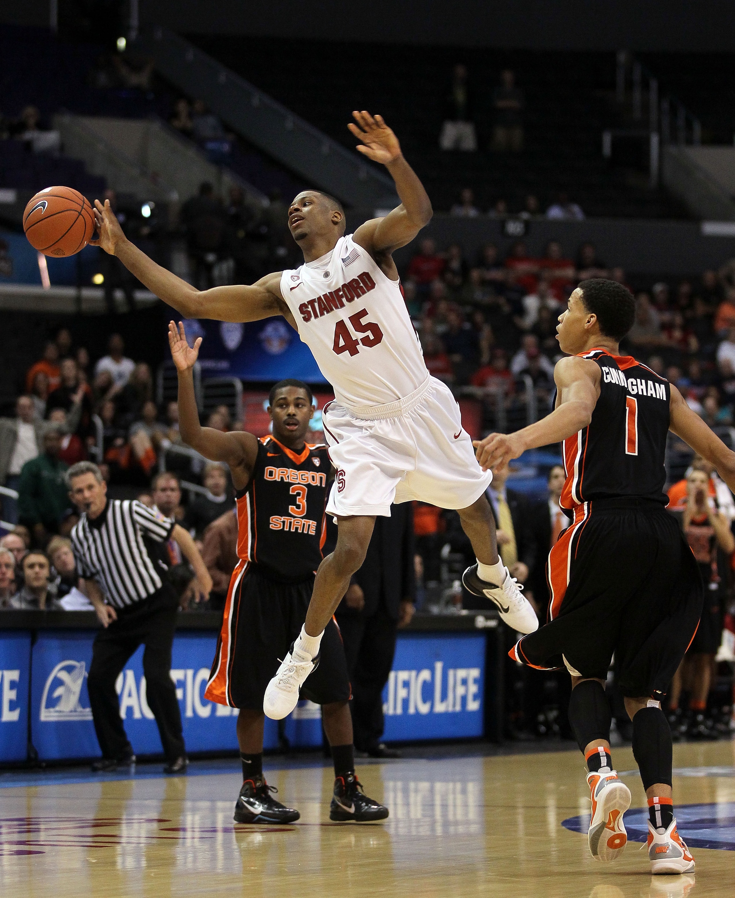 LOS ANGELES, CA - MARCH 09:  Jeremy Green #45 of the Stanford Cardinal has his last second shot attempt blocked by Jared Cunningham #1 of the Oregon State Beavers as the Cardinal lost to the Beavers 69-67 in the first round of the 2011 Pacific Life Pac-10