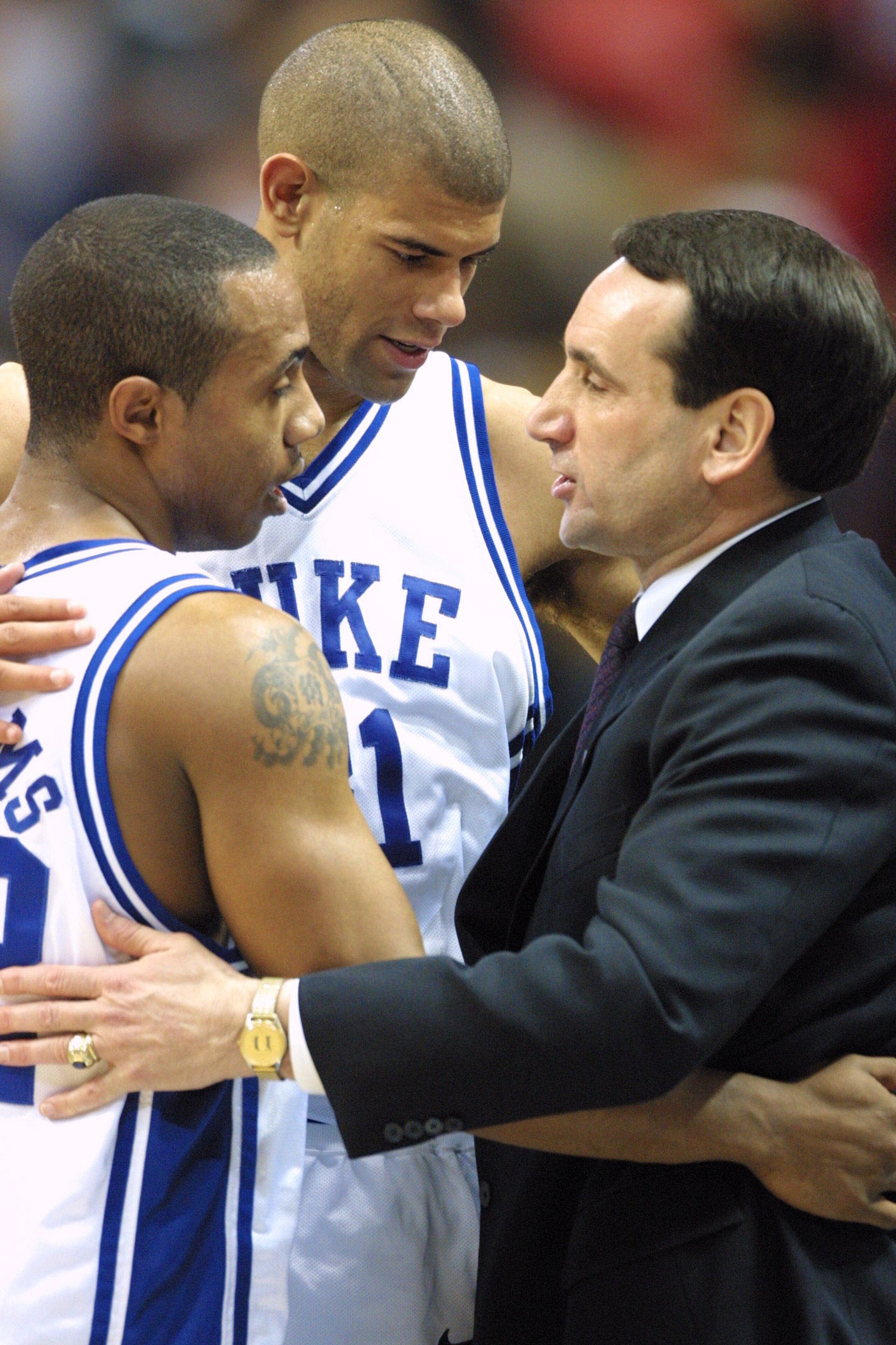 31 Mar 2001:  Shane Battier #31, Jason Williams #22 and head coach Mike Krzyzewski of Duke all share a hug after defeating Maryland 95-84 during the semifinal of the Men's NCAA Basketball Final Four tournament at the Metrodome in Minneapolis, Minnesota.