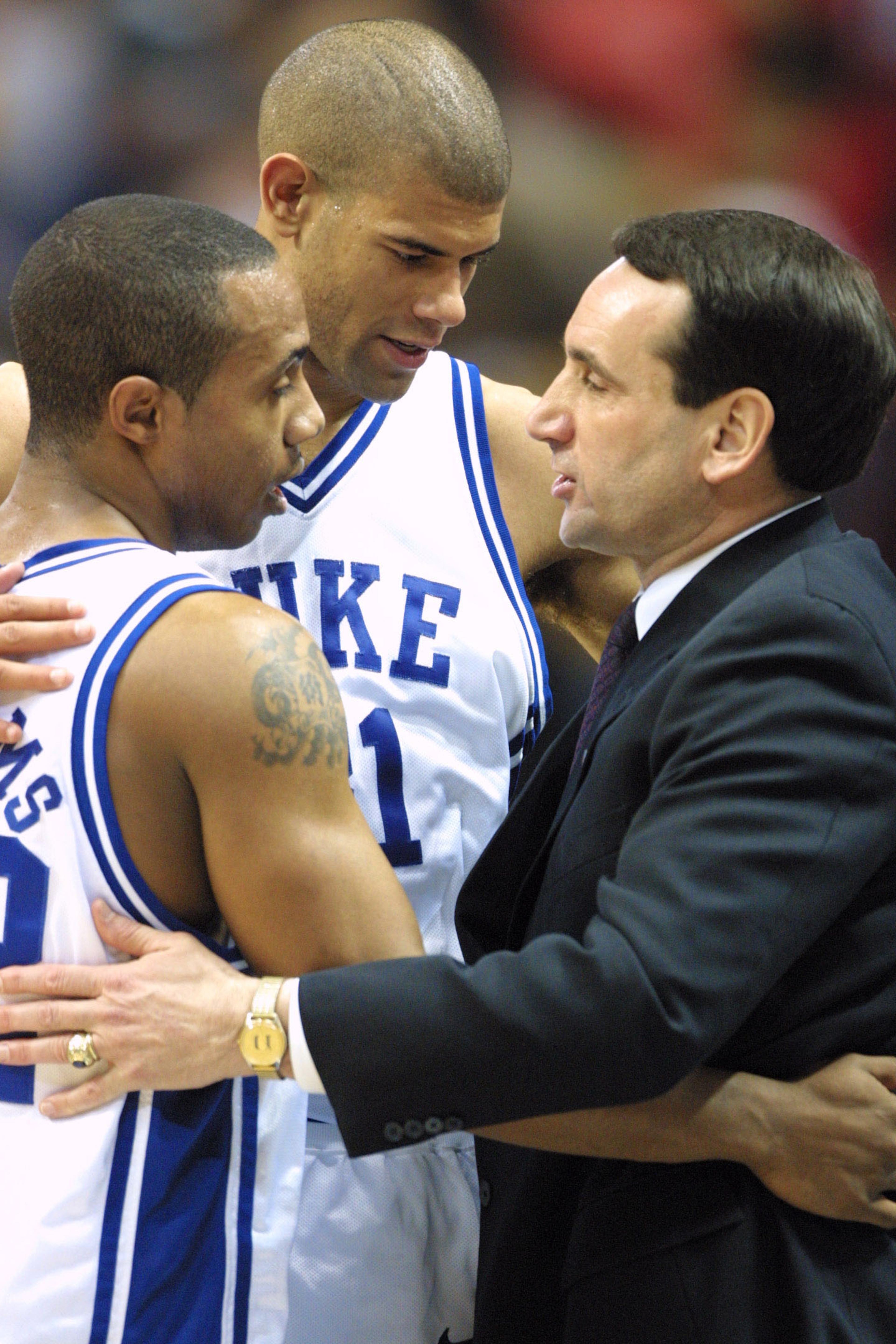 31 Mar 2001:  Shane Battier #31, Jason Williams #22 and head coach Mike Krzyzewski of Duke all share a hug after defeating Maryland 95-84 during the semifinal of the Men's NCAA Basketball Final Four tournament at the Metrodome in Minneapolis, Minnesota.