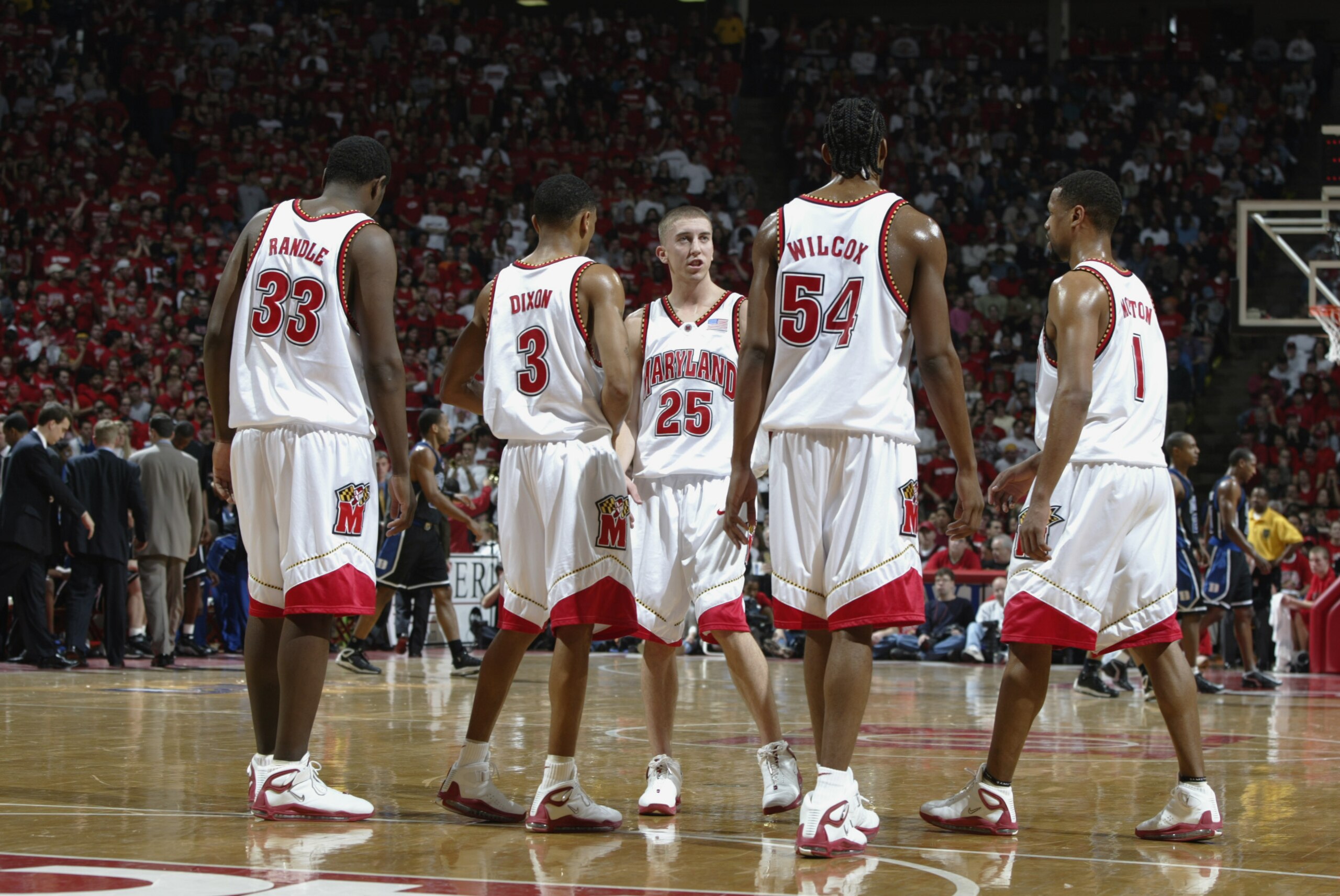 17 Feb 2002:  Steve Blake #25 of Maryland talks to teammates Juan Dixon #3 and Chris Wilcox #54 during the game against Duke at Cole Field House in College Park, Maryland . The Maryland Terrapins beat the Duke Blue Devils 87-73. DIGITAL IMAGE.Mandatory Cr