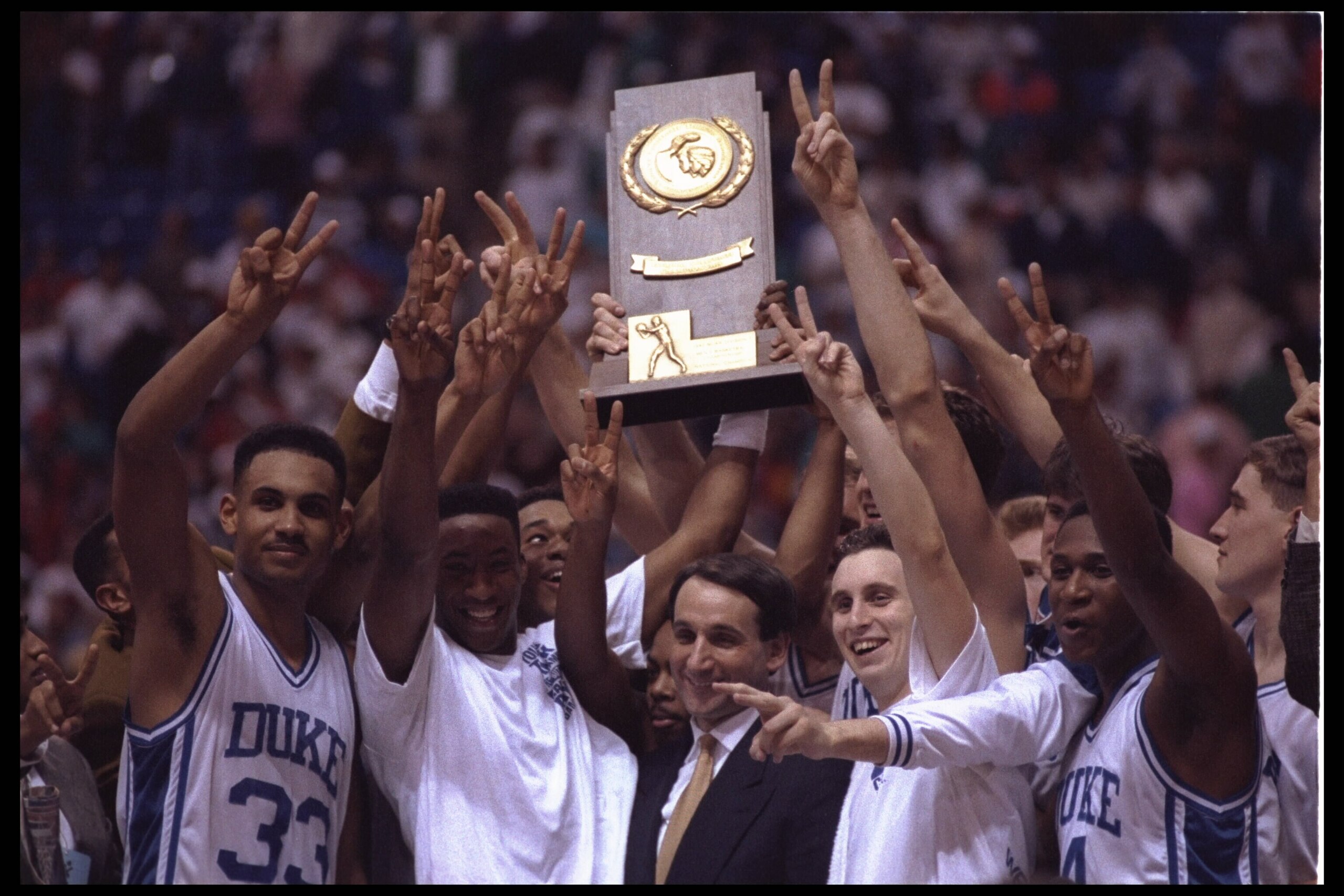 MINNEAPOLIS, MN - APRIL 6:  Head coach Mike Krzyzewski and his Duke Blue Devils revel in their glory after winning their second consecetive NCAA basketball championship by beating the Michigan Wolverines on April 6, 1992 at the Hubert H. Humphrey Metrodom