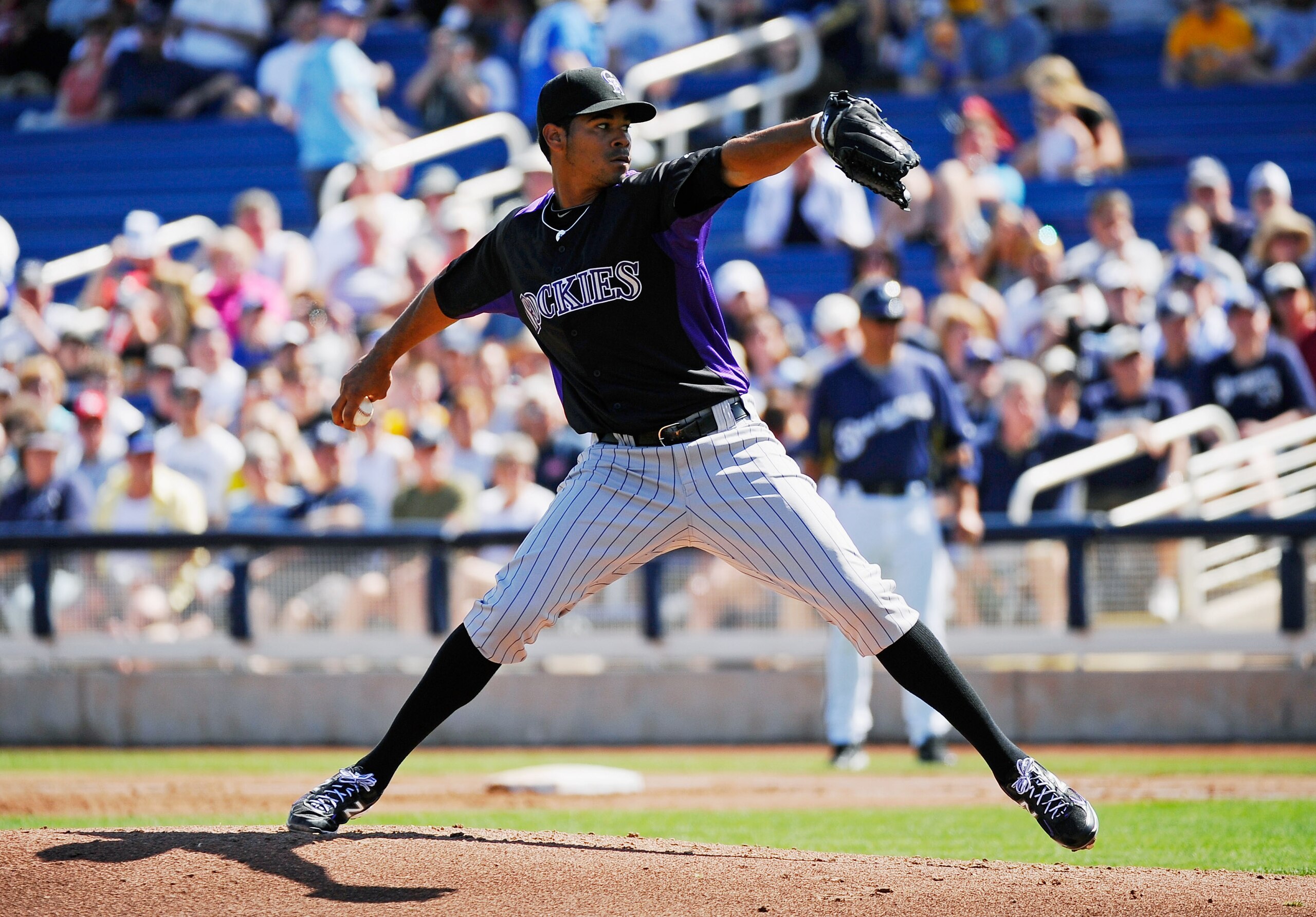 PHOENIX, AZ - MARCH 10:  Esmil Rogers #48 pitcher of the Colorado Rockies throws against the Milwaukee Brewers during the spring training baseball game at Maryvale Baseball Park on March 10, 2011 in Phoenix, Arizona.  (Photo by Kevork Djansezian/Getty Ima