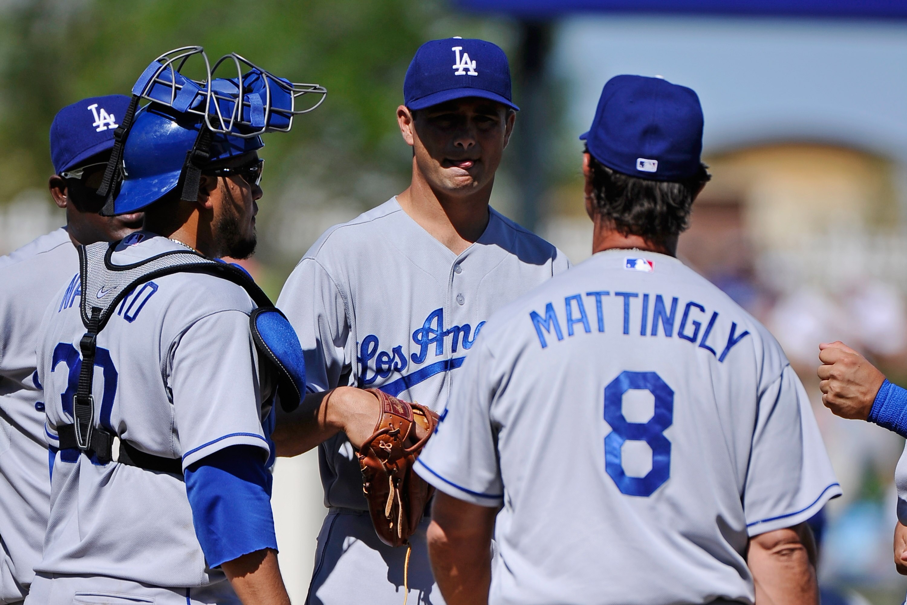 SURPRISE, AZ - MARCH 12:  Pitcher Ted Lilly #29 of the the Los Angeles Dodgers is yanked out in the third inning by manager Don Mattingly #8 during the spring training baseball game against the Kansas City Royals  at Surprise Stadium on March 12, 2011 in 