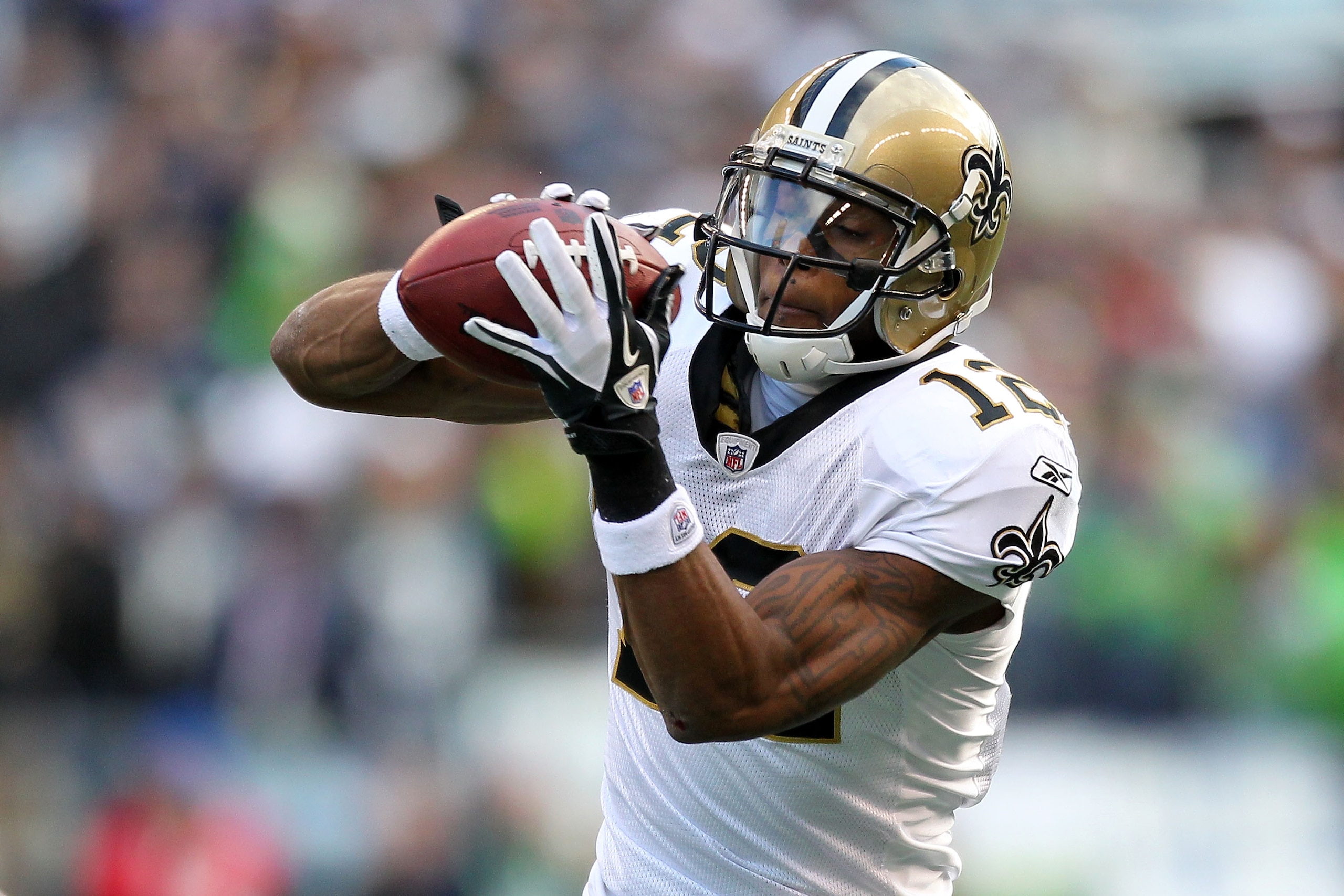 SEATTLE, WA - JANUARY 08:  Marques Colston #12 of the New Orleans Saints catches a pass against the Seattle Seahawks during the 2011 NFC wild-card playoff game at Qwest Field on January 8, 2011 in Seattle, Washington.  (Photo by Otto Greule Jr/Getty Image