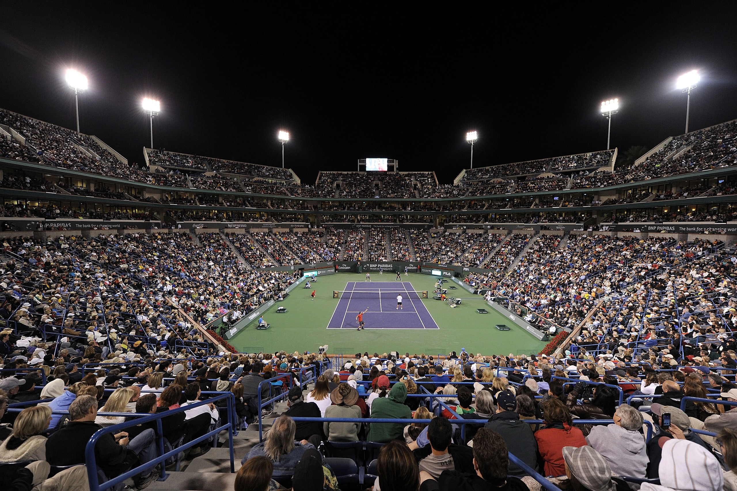 INDIAN WELLS, CA - MARCH 12:  Roger Federer of Switzerland and Pete Sampras of the United States serve to Andre Agassi of the United States and Rafael Nadal of Spain during the BNP Paribas Open  Players Party & Hit for Haiti at the Indian Wells Tennis Gar