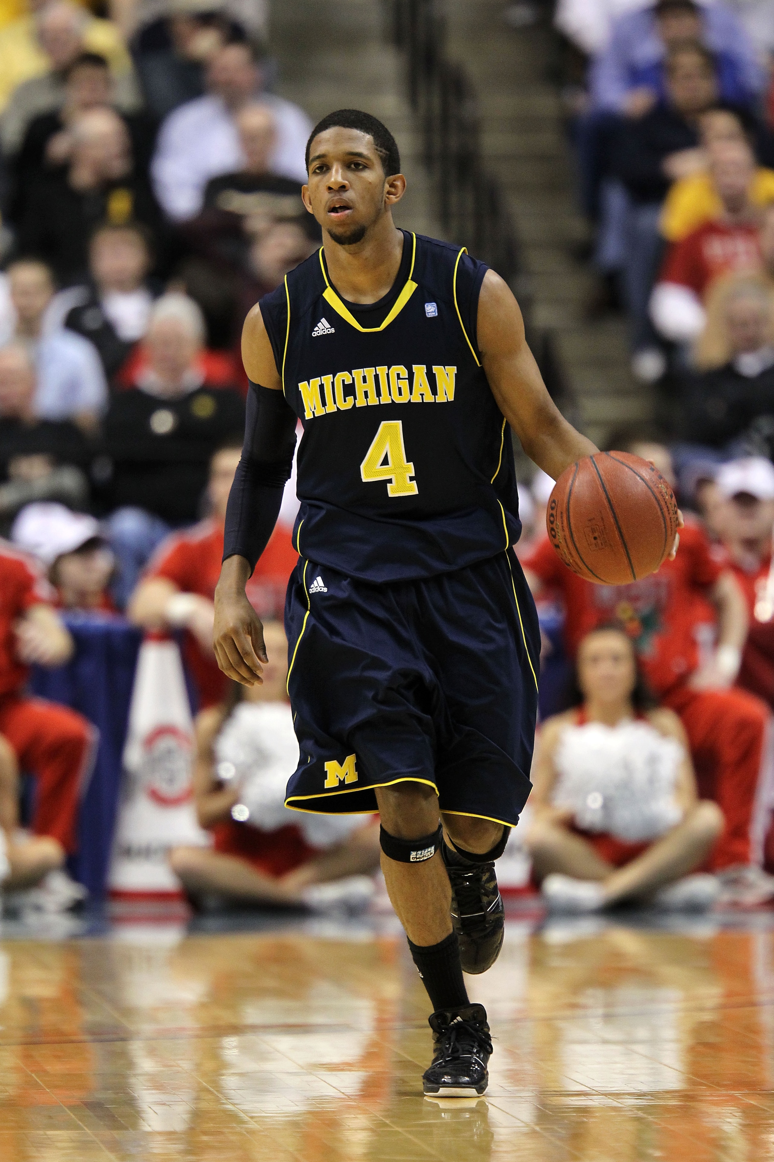 INDIANAPOLIS, IN - MARCH 12:  Darius Morris #4 of the Michigan Wolverines brings the ball up court against the Ohio State Buckeyes during the semifinals of the 2011 Big Ten Men's Basketball Tournament at Conseco Fieldhouse on March 12, 2011 in Indianapoli