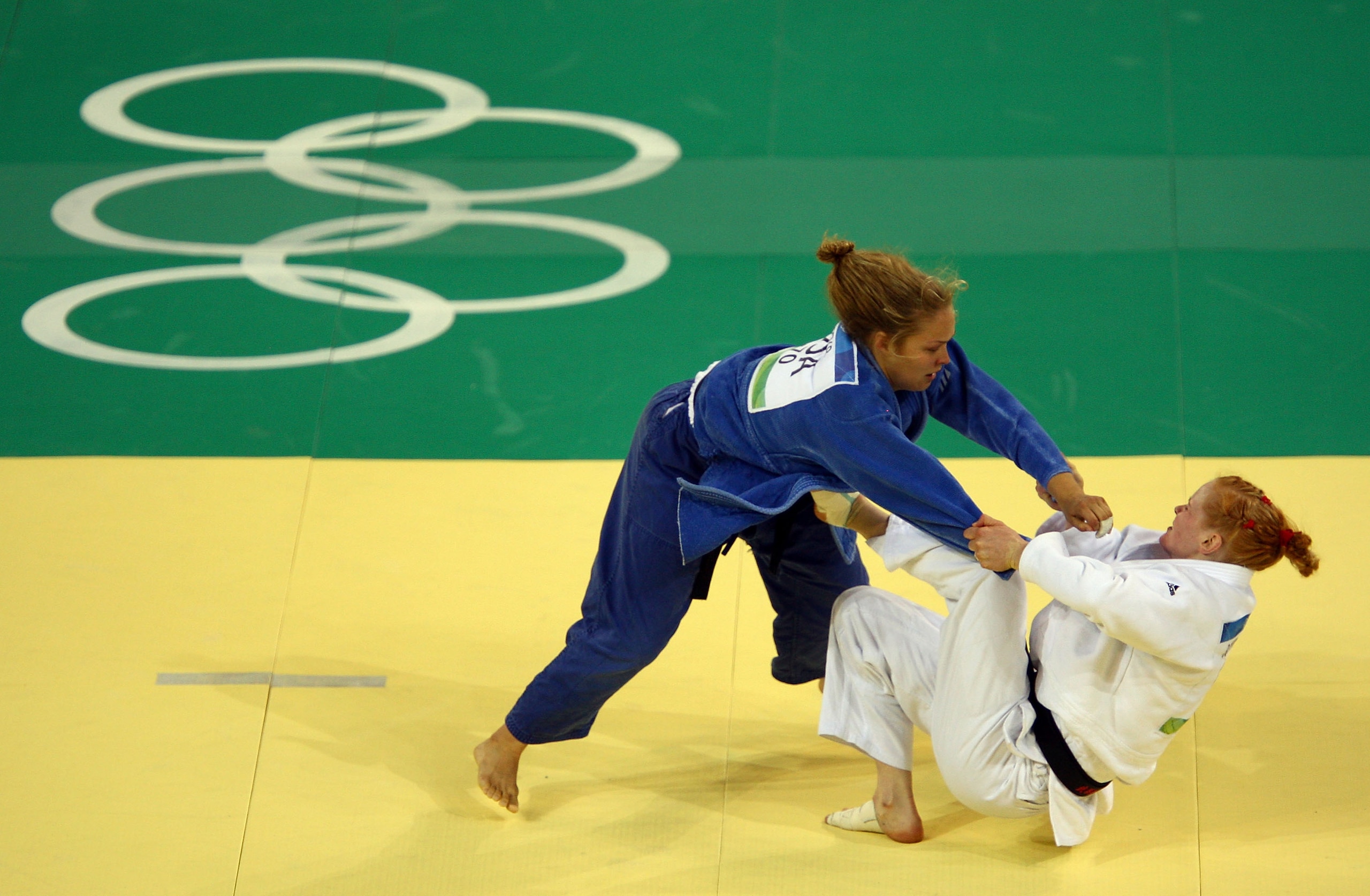 BEIJING - AUGUST 13:  Ronda Rousey of the United States competes against Annett Boehm of Germany in their Women's 70 kg Bronze Medal Contest judo bout at the University of Science and Technology Gymnasium during Day 5 of the Beijing 2008 Olympic Games on