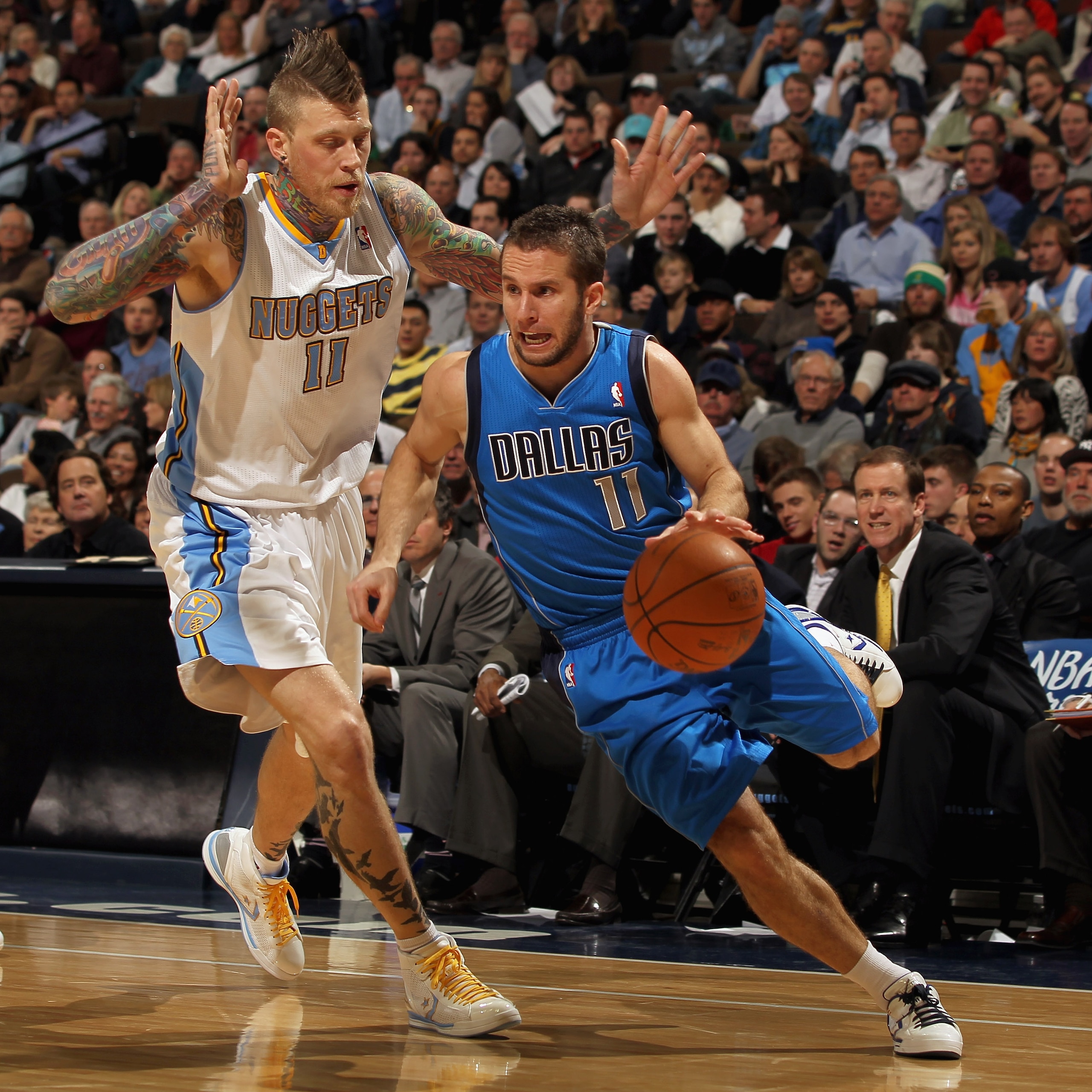 DENVER, CO - FEBRUARY 10: Jose Barea #11 of the Dallas Mavericks drives the ball against Chris Andersen #11 of the Denver Nuggets during NBA action at the Pepsi Center on February 10, 2011 in Denver, Colorado. NOTE TO USER: User expressly acknowledges an DENVER, CO - FEBRUARY 10: Jose Barea #11 of the Dallas Mavericks drives the ball against Chris Andersen #11 of the Denver Nuggets during NBA action at the Pepsi Center on February 10, 2011 in Denver, Colorado. NOTE TO USER: User expressly acknowledges an