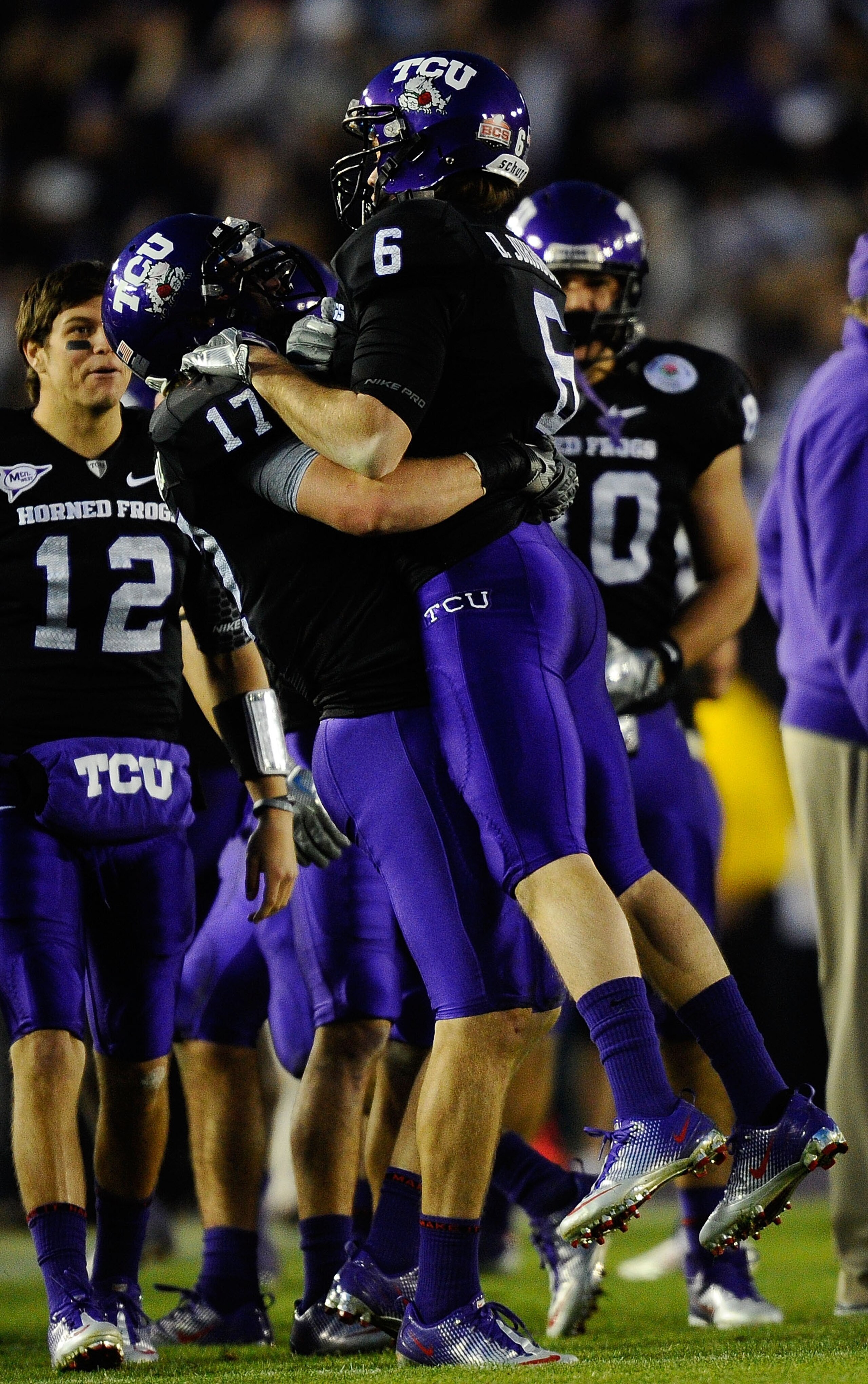 PASADENA, CA - JANUARY 01:  Safety Tyler Luttrell #17 of the TCU Horned Frogs celebrates with wide receiver Bart Johnson #6 in the final moments of their 21-19 win over the Wisconsin Badgers in the 97th Rose Bowl game on January 1, 2011 in Pasadena, Calif
