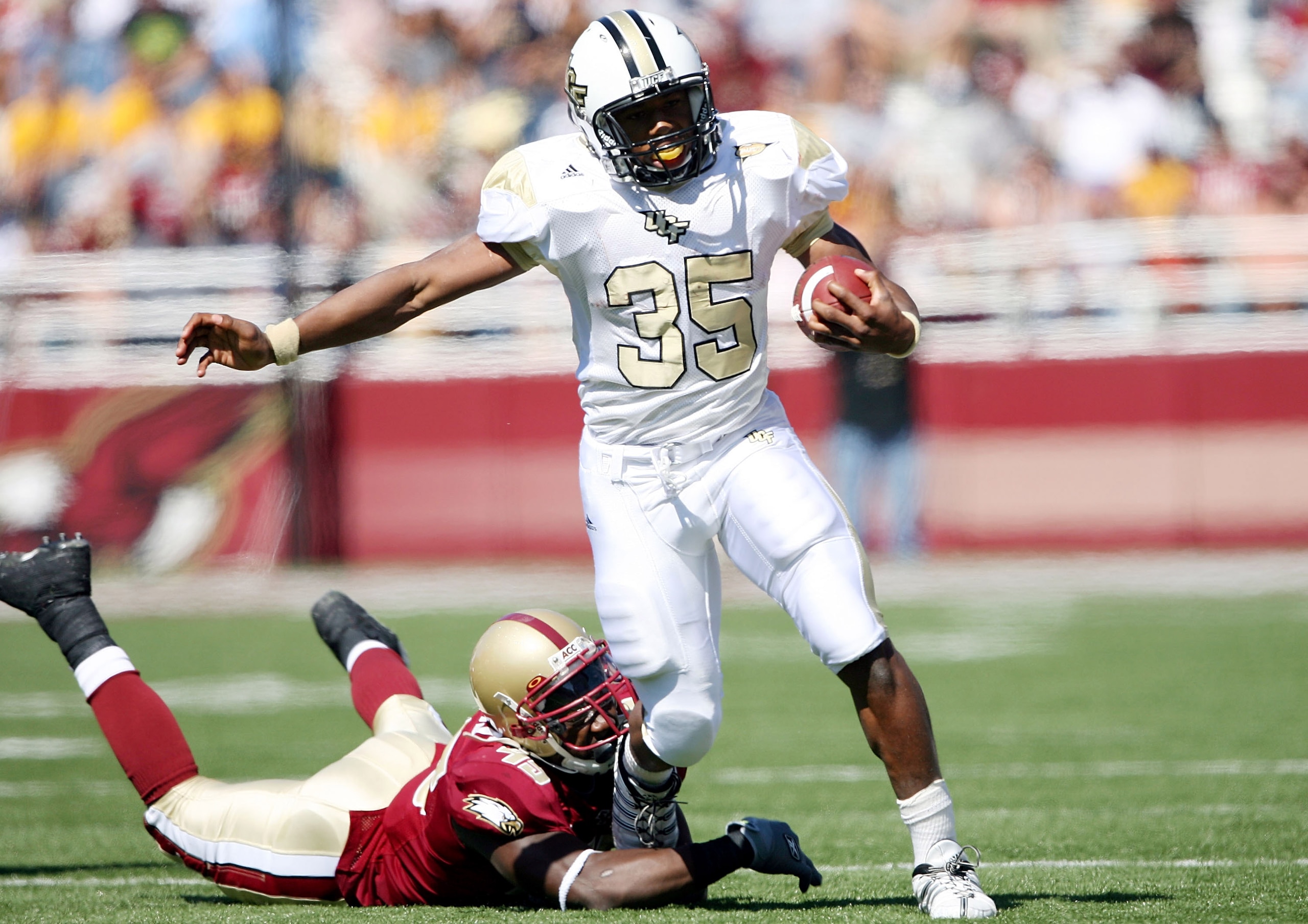 CHESTNUT HILL, MA - SEPTEMBER 20:  Ronnie Weaver #35 of the Central Florida Knights carries the ball as Wes Davis #45 of the Boston College Eagles tries to tackle on September 20, 2008 at Alumni Stadium in Chestnut Hill, Massachusetts.  (Photo by Elsa/Get