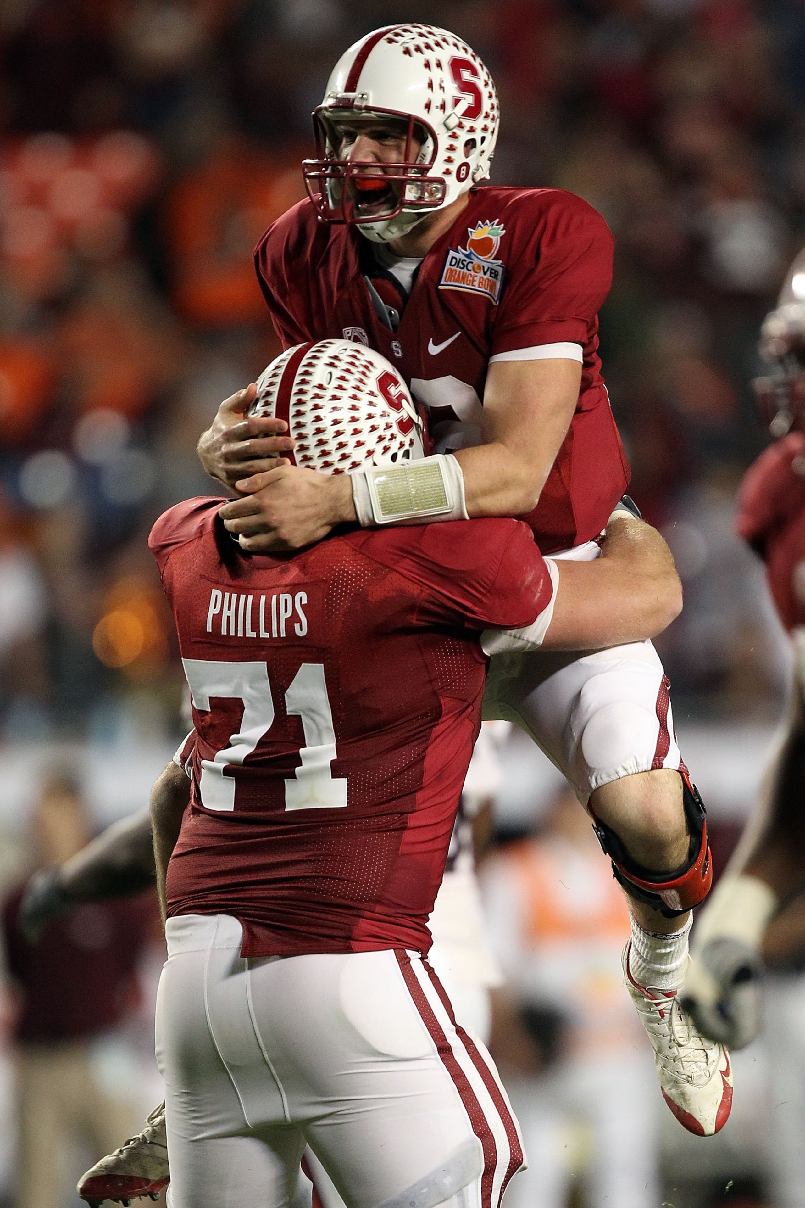 MIAMI, FL - JANUARY 03: Andrew Luck #12 of the Stanford Cardinal with Andrew Phillips #71 celebrates after he threw a 38-yard touchdown pass in the fourth quarter against the Virginia Tech Hokies during the 2011 Discover Orange Bowl at Sun Life Stadium on