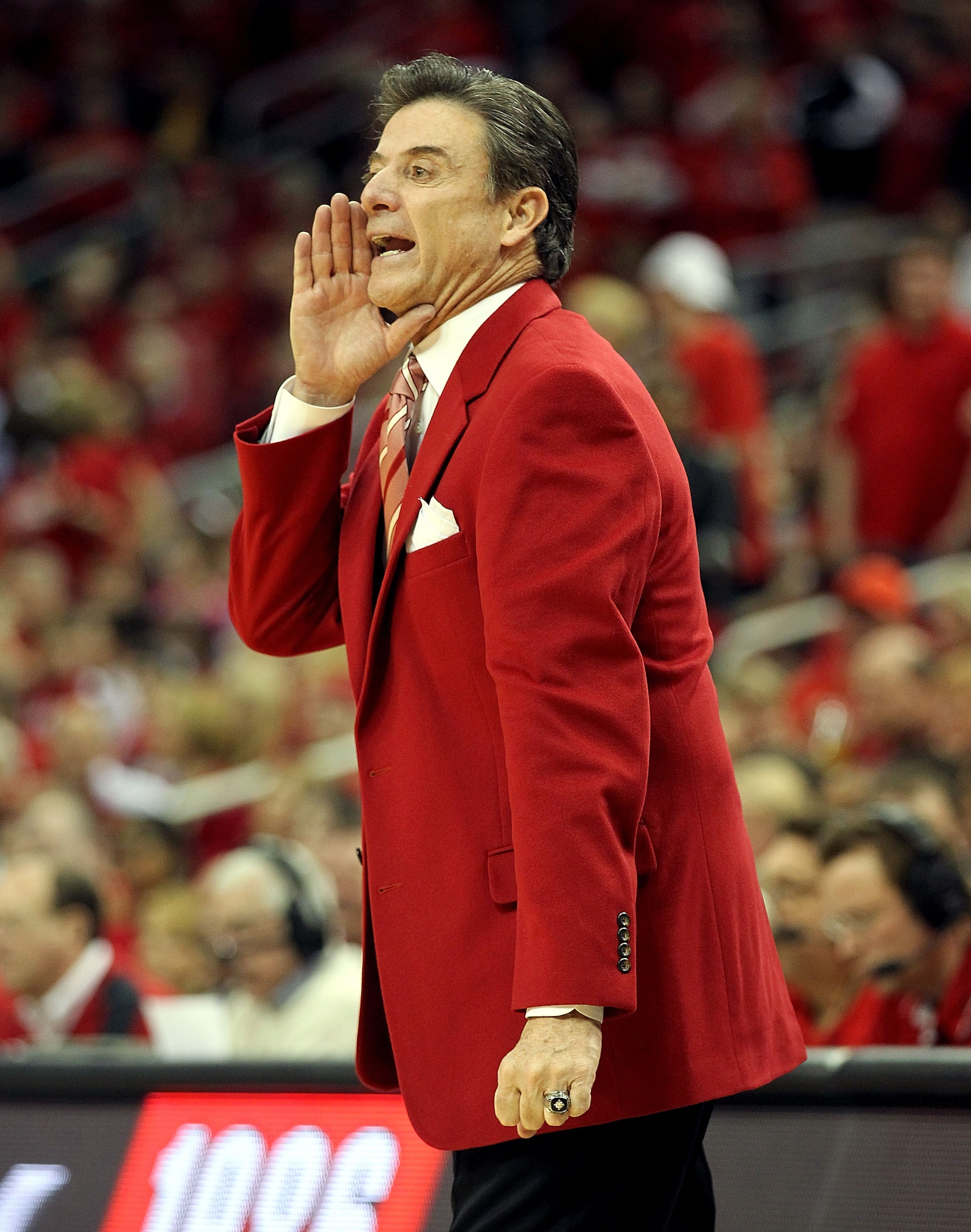 LOUISVILLE, KY - MARCH 02:  Rick Pitino the Head Coach of the Louisville Cardinals gives instructions to his team during the Big East Conference game against the Providence Friars at the KFC Yum! Center on March 2, 2011 in Louisville, Kentucky.  (Photo by