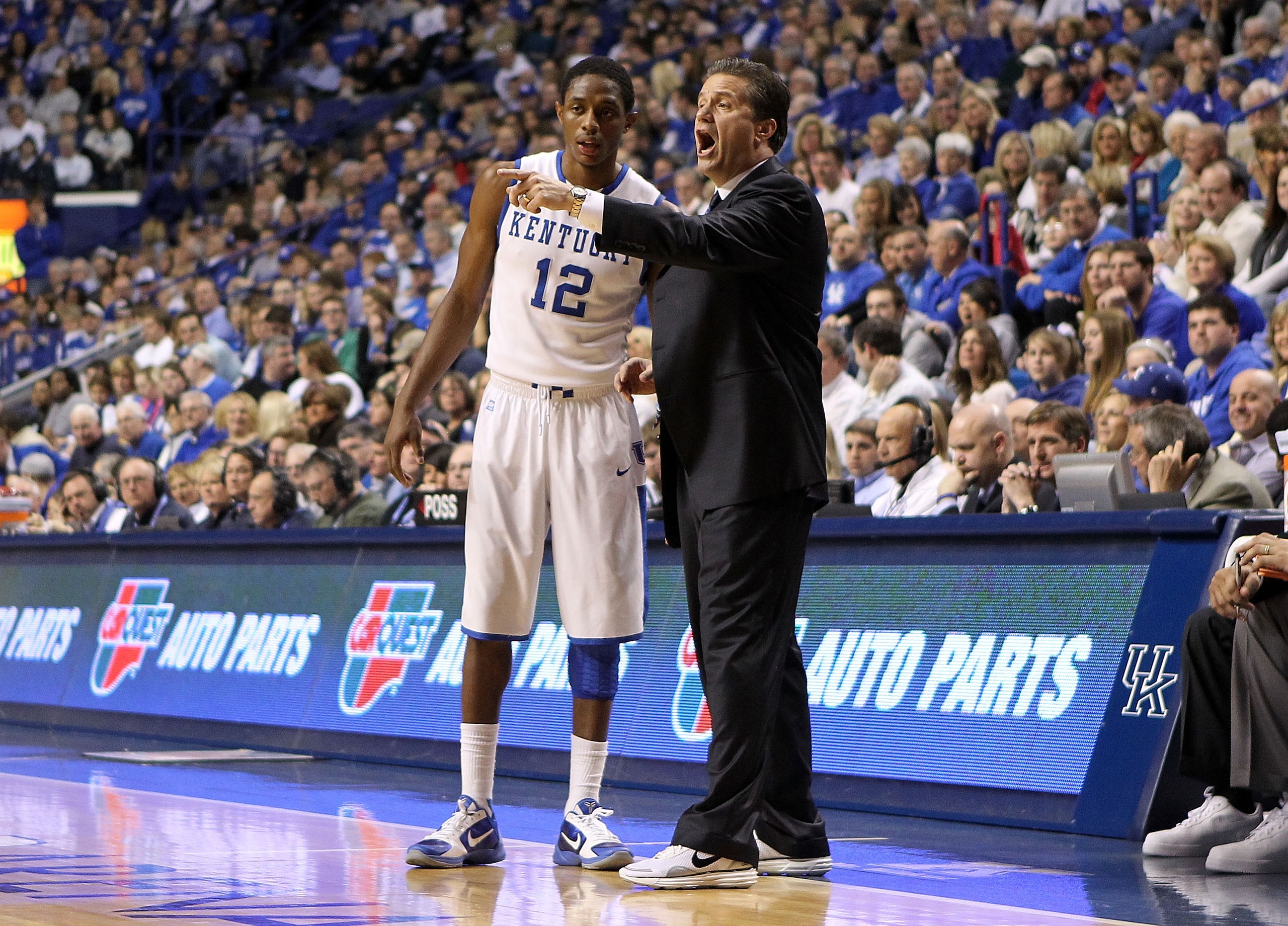 LEXINGTON, KY - JANUARY 29:  John Calipari the Head Coach of the Kentucky Wildcats gives instructions to Brandon Knight #12 during the SEC game against the Georgia Bulldogs at Rupp Arena on January 29, 2011 in Lexington, Kentucky. Kentucky won 66-60.  (Ph