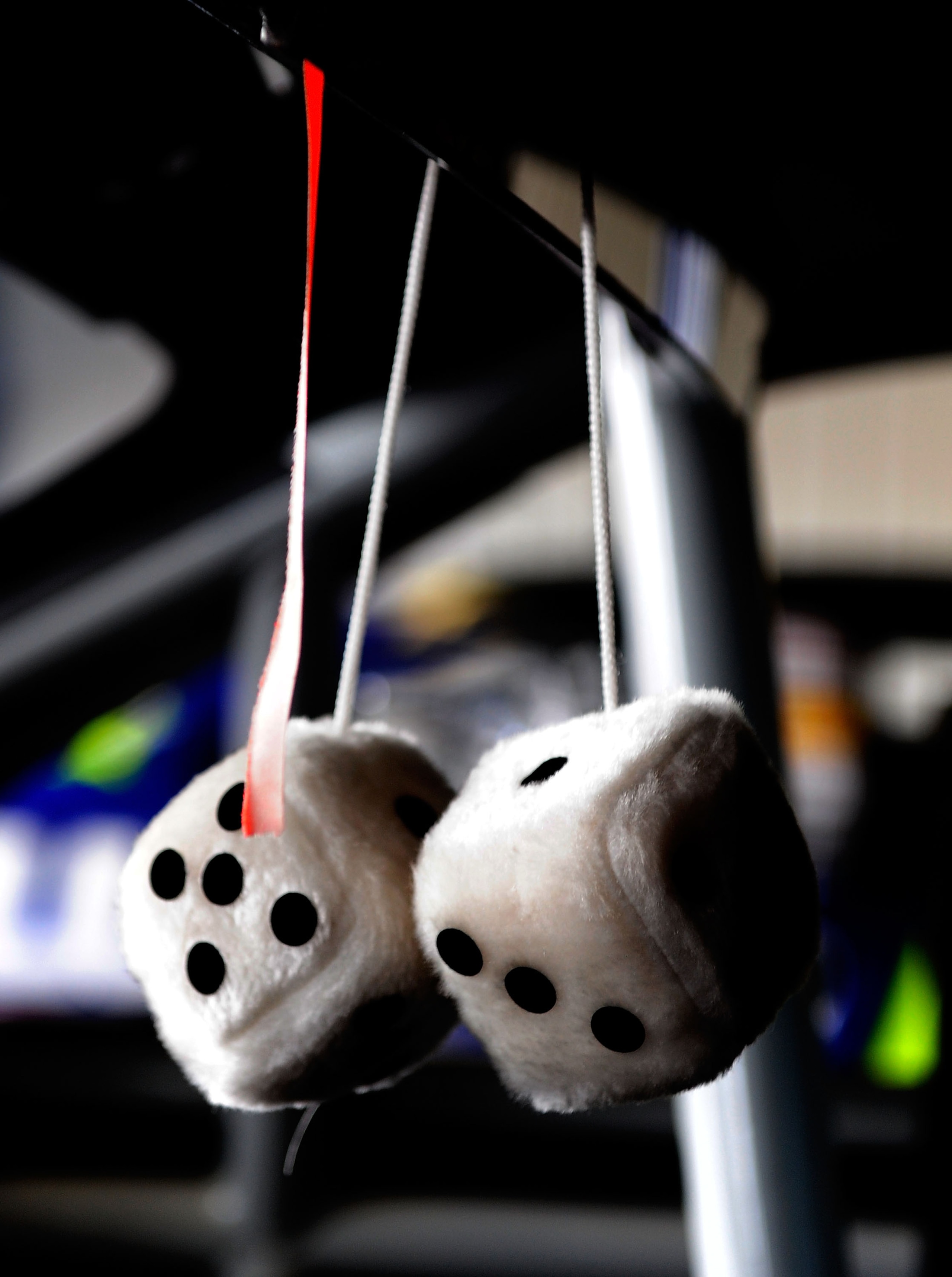LONG POND, PA - JULY 31:  A pair of fuzzy dice hang on the rear-view mirror of the #14 Old Spice Swagger Chevrolet, driven by Tony Stewart, prior to practice for the NASCAR Sprint Cup Series Sunoco Red Cross Pennsylvania 500 at the Pocono Raceway on July