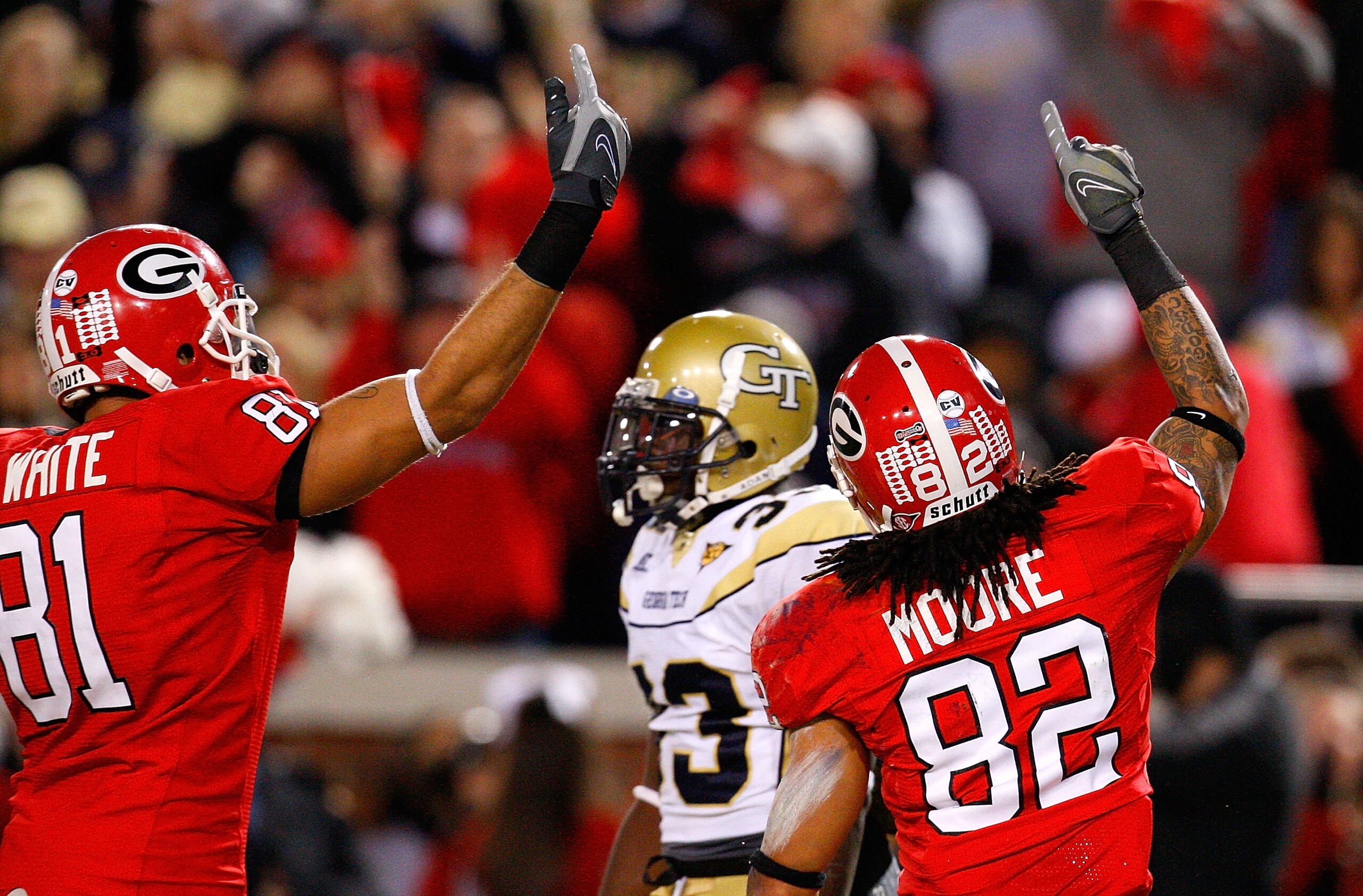 ATLANTA - NOVEMBER 28:  Aron White #81 and Michael Moore #82 of the Georgia Bulldogs celebrate Moore's touchdown against the Georgia Tech Yellow Jackets at Bobby Dodd Stadium on November 28, 2009 in Atlanta, Georgia.  (Photo by Kevin C. Cox/Getty Images)