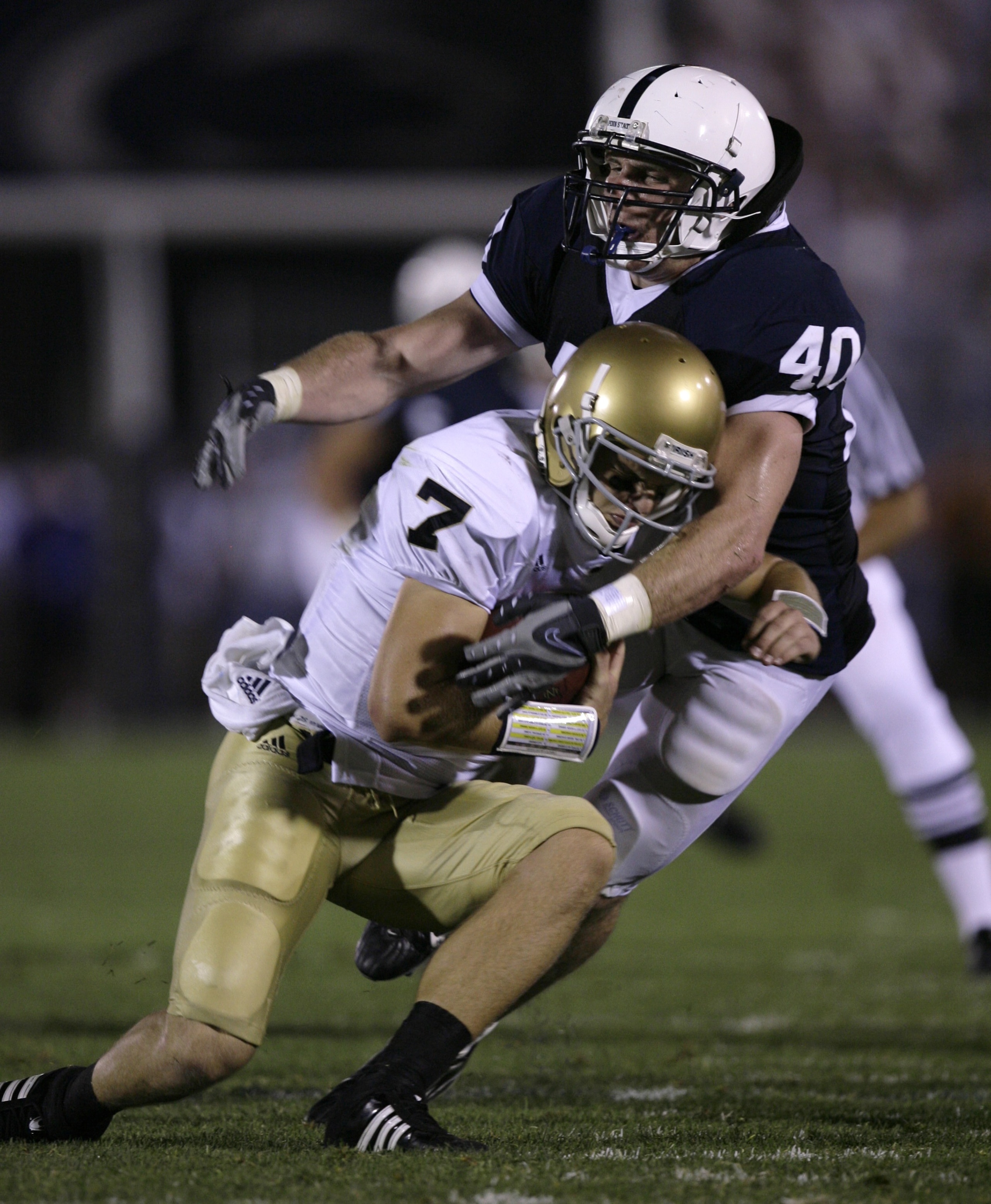 STATE COLLEGE, PA - SEPTEMBER 8: Quarterback Jimmy Clausen #7 of Notre Dame is sacked by linebacker Dan Connor #40 of Penn State during the second half of the game between University of Notre Dame Fighting Irish and Penn State Nittany Lions September 8, 2 STATE COLLEGE, PA - SEPTEMBER 8: Quarterback Jimmy Clausen #7 of Notre Dame is sacked by linebacker Dan Connor #40 of Penn State during the second half of the game between University of Notre Dame Fighting Irish and Penn State Nittany Lions September 8, 2