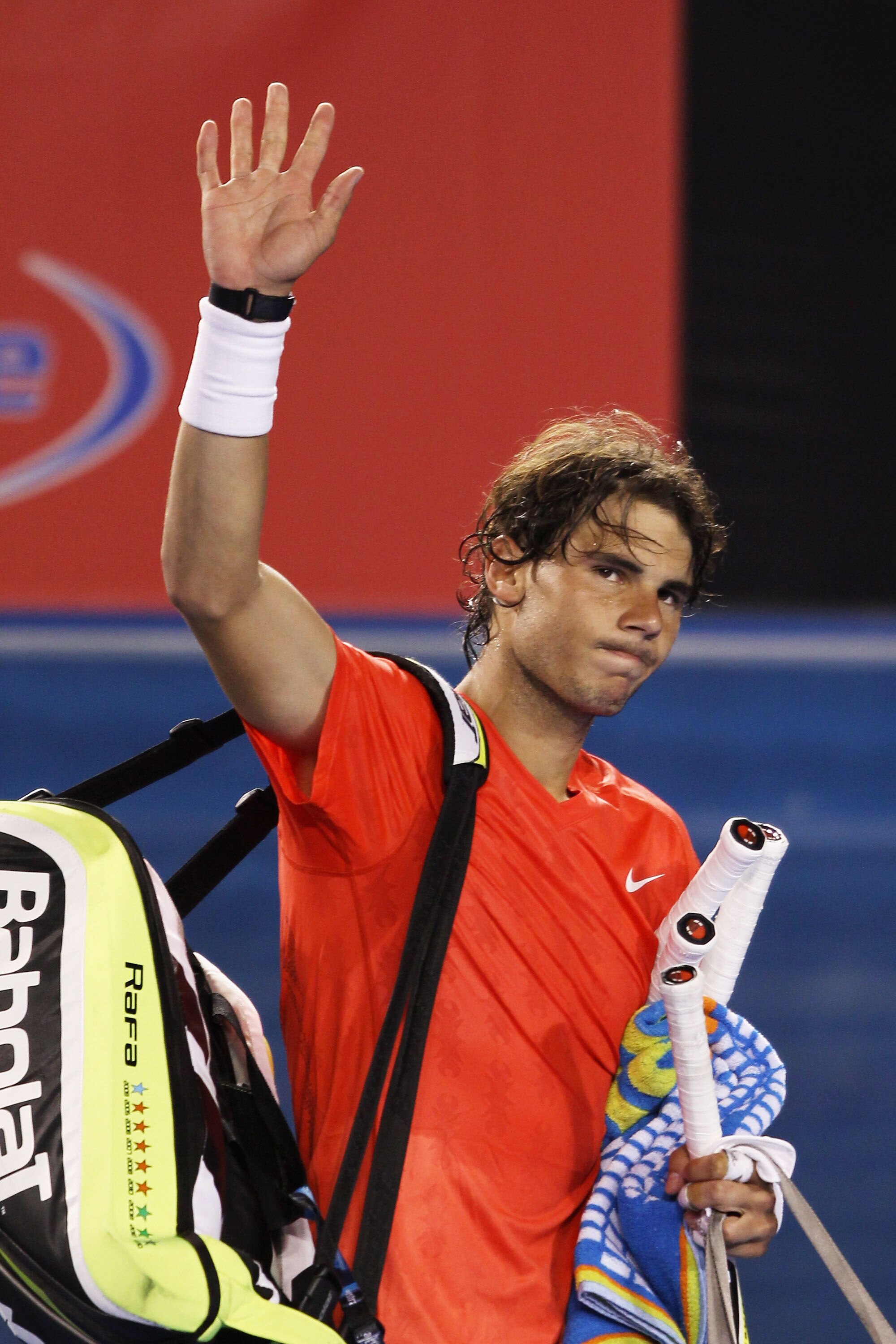 MELBOURNE, AUSTRALIA - JANUARY 26:  Rafael Nadal of Spain waves after losing in his quarterfinal match against David Ferrer of Spain during day ten of the 2011 Australian Open at Melbourne Park on January 26, 2011 in Melbourne, Australia.  (Photo by Clive