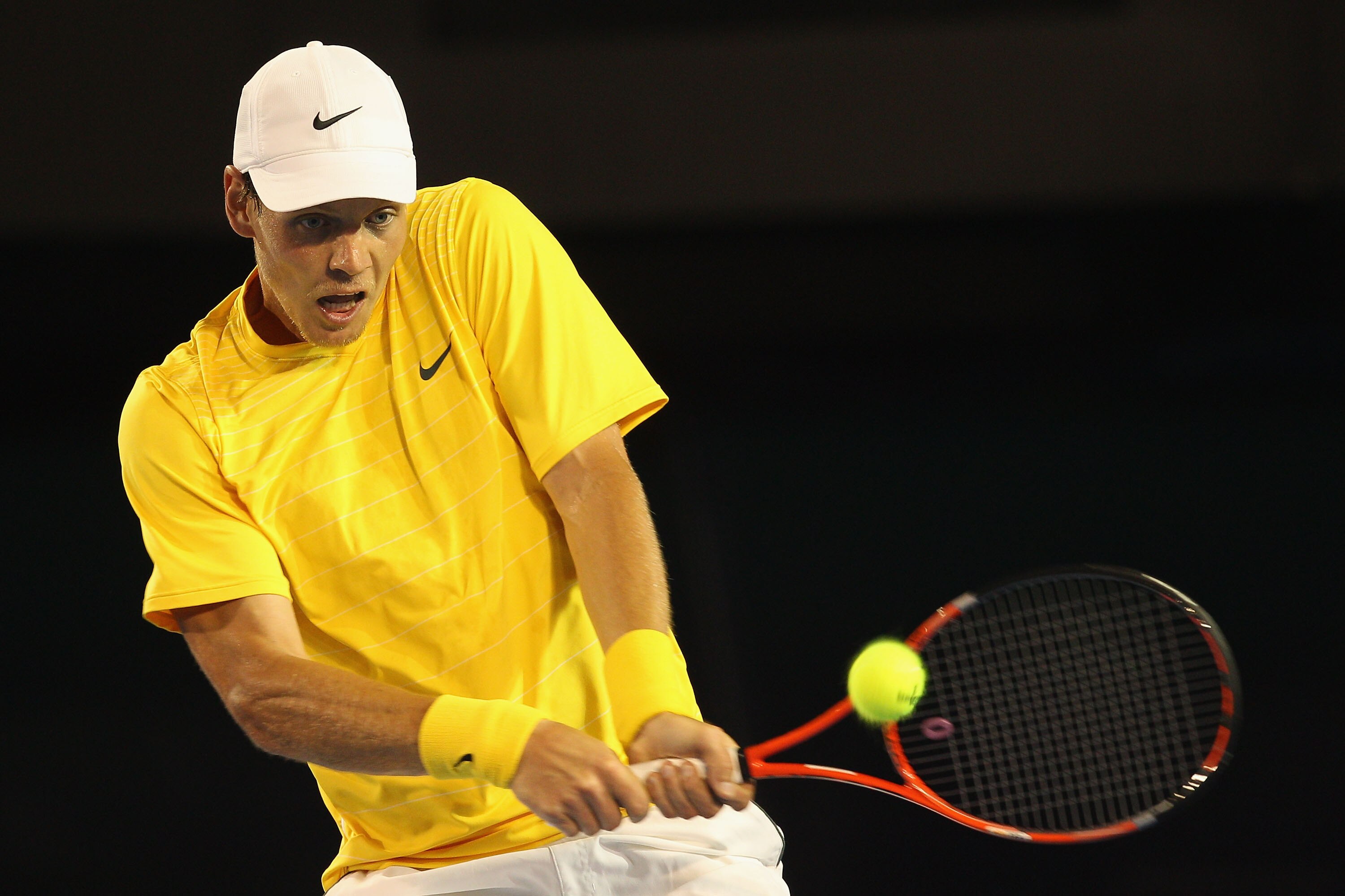 MELBOURNE, AUSTRALIA - JANUARY 25:  Tomas Berdych of the Czech Republic plays a backhand in his quarterfinal match against Novak Djokovic of Serbia during day nine of the 2011 Australian Open at Melbourne Park on January 25, 2011 in Melbourne, Australia.