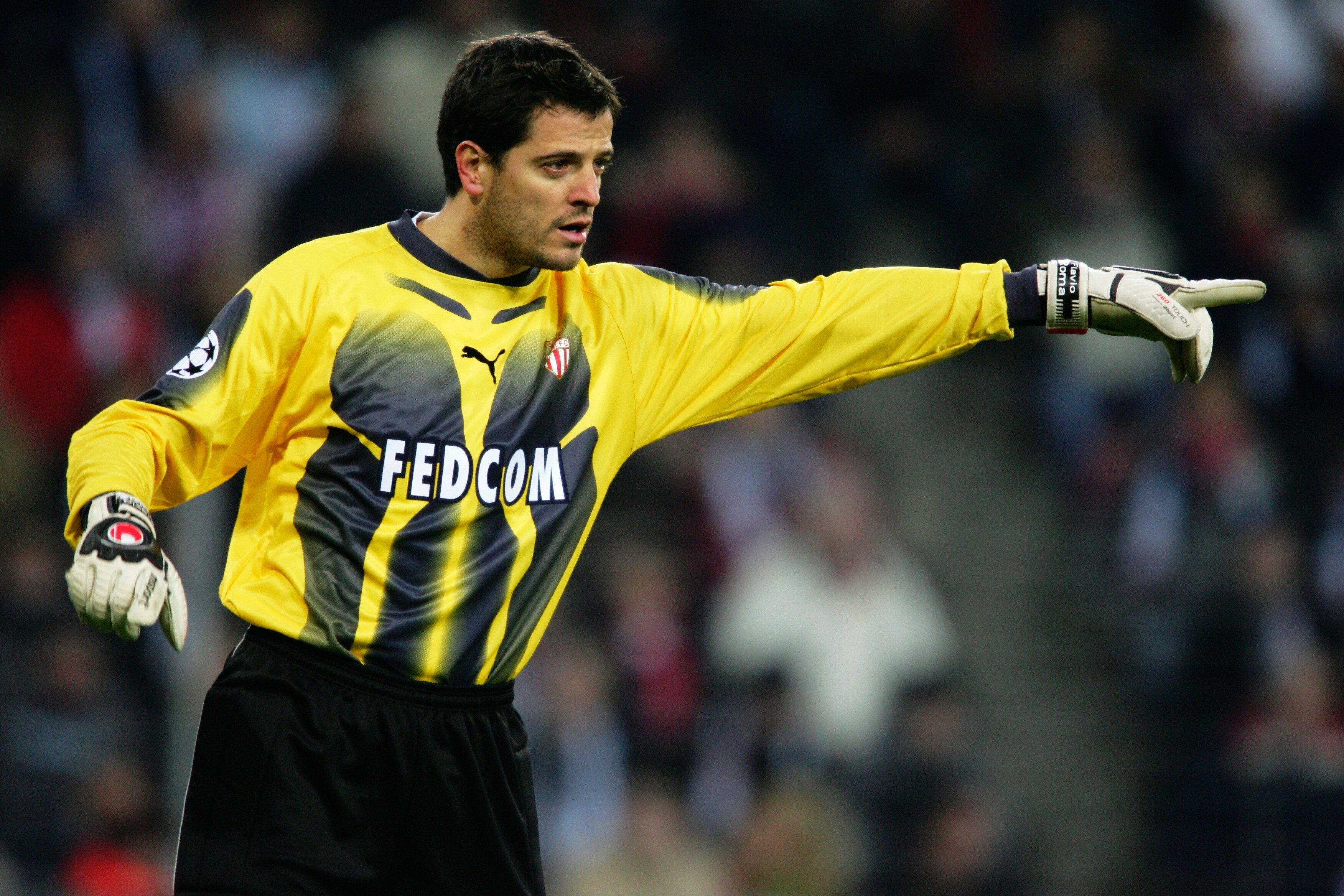 EINDHOVEN, HOLLAND - FEBRUARY 22:  Flavio Roma of Monaco organises his defence during the UEFA Champions League first knock-out round, first leg match between PSV Eindhoven and AS Monaco at the Phillips Stadium on February 22, 2005 in Eindhoven, Holland. 
