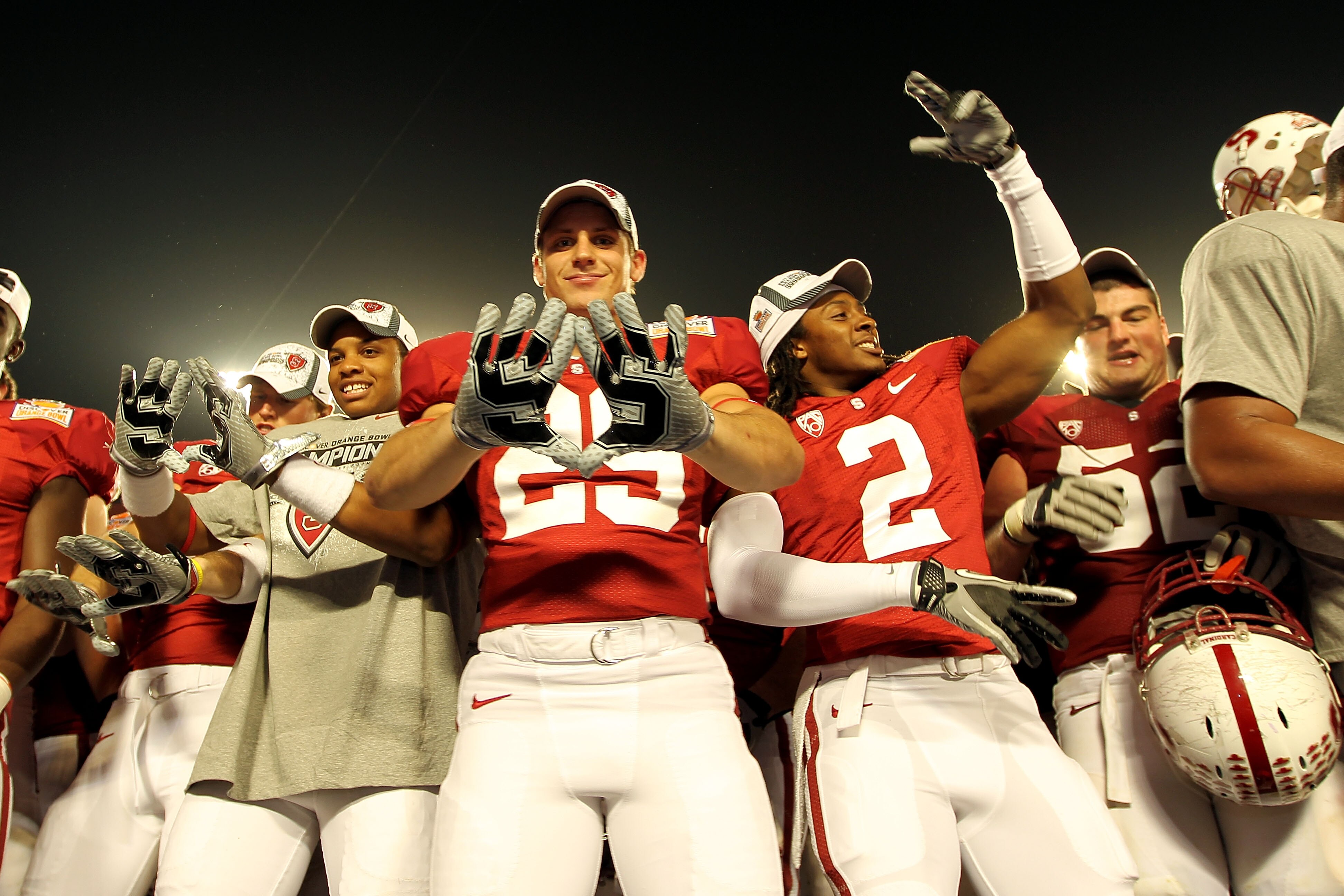MIAMI, FL - JANUARY 03: Ed Reynolds #29 and Corey Galewood #2 of the Stanford Cardinal celebrates after Stanford won 40-12 against the Virginia Tech Hokies during the 2011 Discover Orange Bowl at Sun Life Stadium on January 3, 2011 in Miami, Florida. (P MIAMI, FL - JANUARY 03: Ed Reynolds #29 and Corey Galewood #2 of the Stanford Cardinal celebrates after Stanford won 40-12 against the Virginia Tech Hokies during the 2011 Discover Orange Bowl at Sun Life Stadium on January 3, 2011 in Miami, Florida. (P