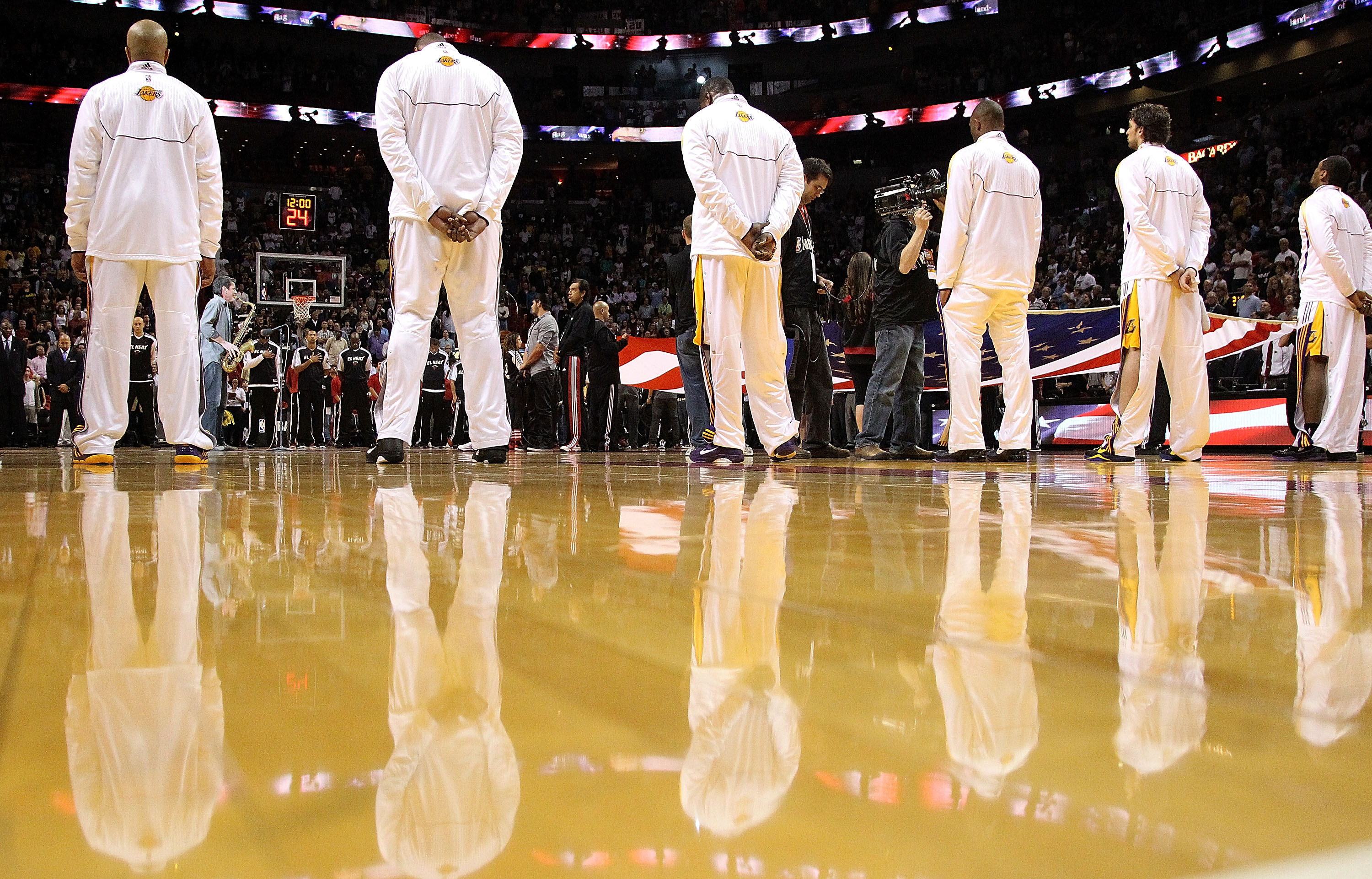 MIAMI, FL - MARCH 10:  The Los Angeles Lakers look on during the national anthem during a game against the Miami Heat at American Airlines Arena on March 10, 2011 in Miami, Florida. NOTE TO USER: User expressly acknowledges and agrees that, by downloading