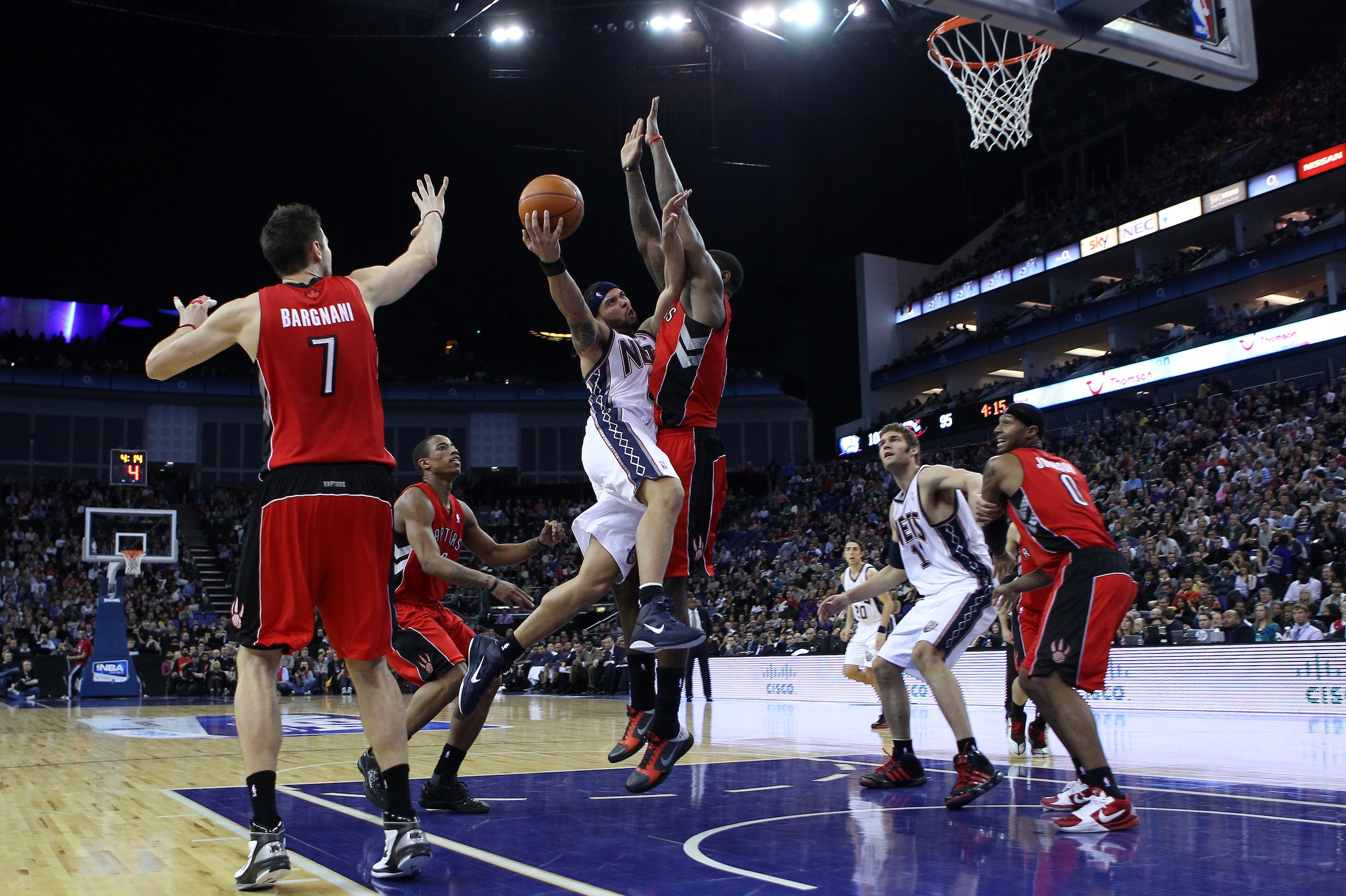 LONDON, ENGLAND - MARCH 04:  Deron Williams of the Nets attacks the Raptors defence during the NBA match between New Jersey Nets and the Toronto Raptors at the O2 Arena on March 4, 2011 in London, England. NOTE TO USER: User expressly acknowledges and agr