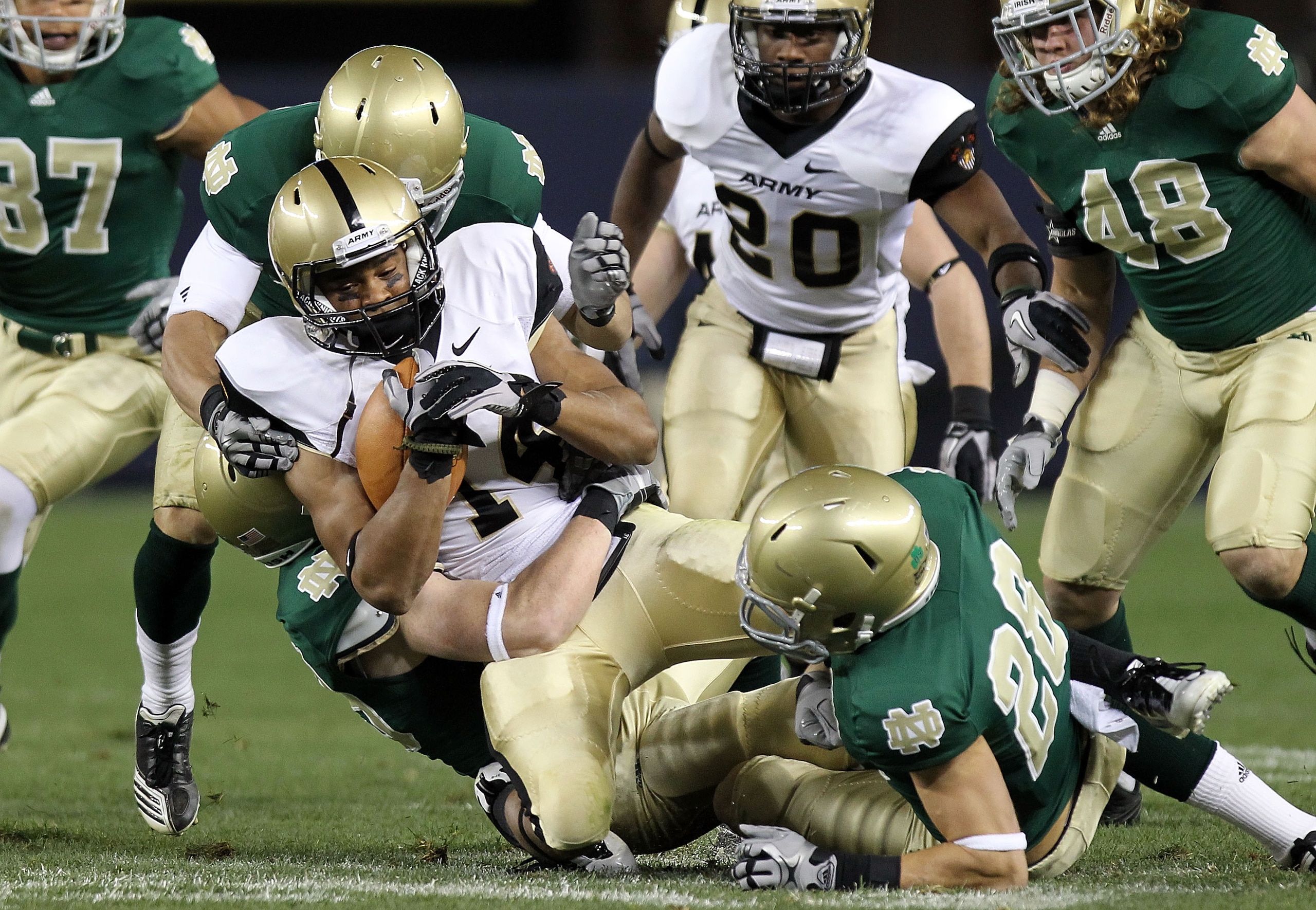 NEW YORK - NOVEMBER 20: Josh Jackson #14 of the Army Black Knights is tackled on a kickoff return by the Notre Dame Fighting Irish at Yankee Stadium on November 20, 2010 in the Bronx borough of New York City.  (Photo by Nick Laham/Getty Images)