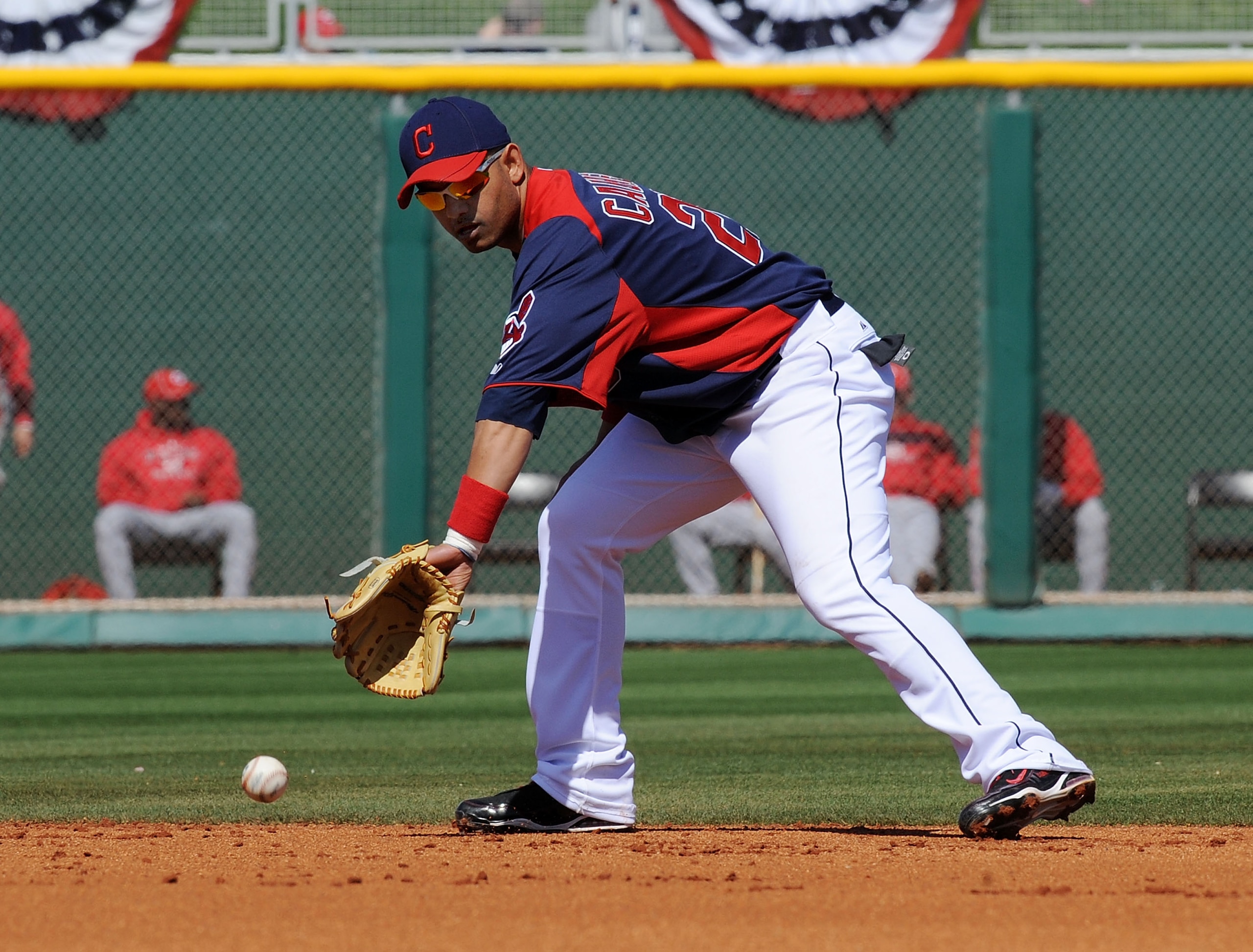 GOODYEAR, AZ - FEBRUARY 27:  Orlando Cabrera #20 of the Cleveland Indians fields a ground ball against the Cincinnati Reds at Goodyear Ballpark on February 27, 2011 in Goodyear, Arizona.  (Photo by Norm Hall/Getty Images)