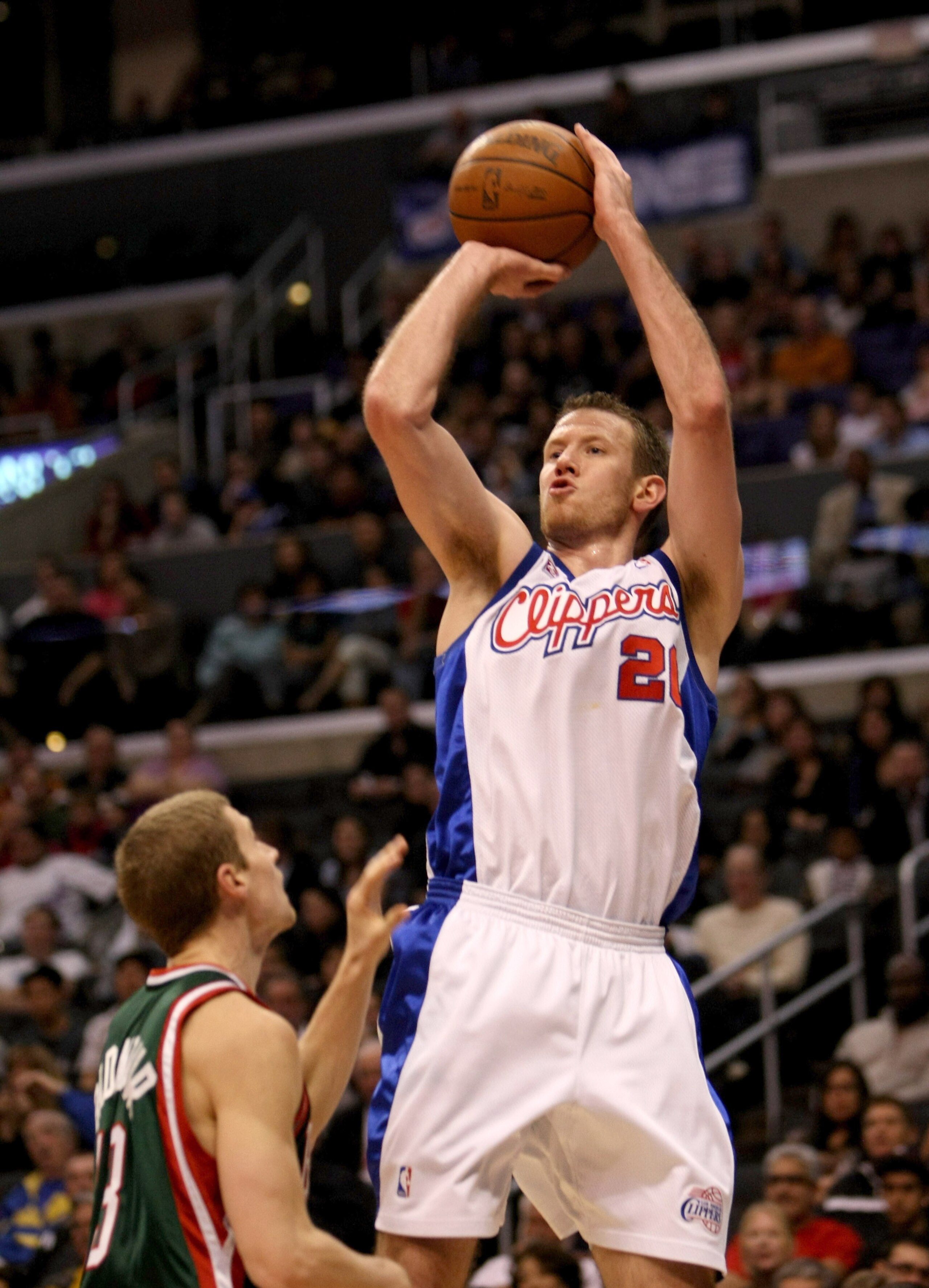 LOS ANGELES, CA - JANUARY 17: Steve Novak #21 of the Los Angeles Clippers shoots over Luke Ridnour #13 of the Milwaukee Bucks on January 17, 2009 at Staples Center in Los Angeles, California. The Clippers won 101-92. NOTE TO USER: User expressly acknowl LOS ANGELES, CA - JANUARY 17: Steve Novak #21 of the Los Angeles Clippers shoots over Luke Ridnour #13 of the Milwaukee Bucks on January 17, 2009 at Staples Center in Los Angeles, California. The Clippers won 101-92. NOTE TO USER: User expressly acknowl