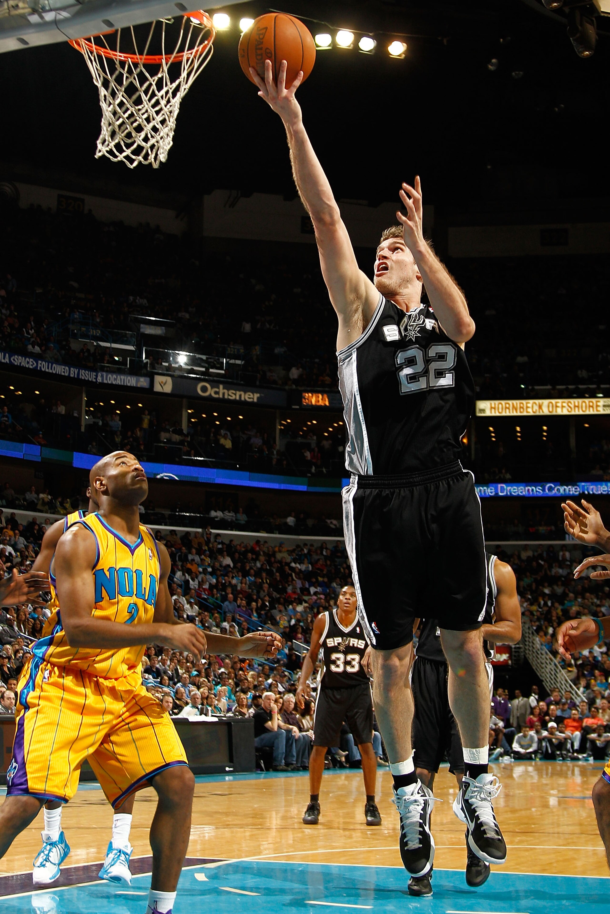 NEW ORLEANS, LA - JANUARY 22: Tiago Splitter #22 of the San Antonio Spurs shoots the ball over Jarrett Jack #2 of the New Orleans Hornets at the New Orleans Arena on January 22, 2011 in New Orleans, Louisiana. The Hornets defeated the Spurs 96-72. NOTE NEW ORLEANS, LA - JANUARY 22: Tiago Splitter #22 of the San Antonio Spurs shoots the ball over Jarrett Jack #2 of the New Orleans Hornets at the New Orleans Arena on January 22, 2011 in New Orleans, Louisiana. The Hornets defeated the Spurs 96-72. NOTE